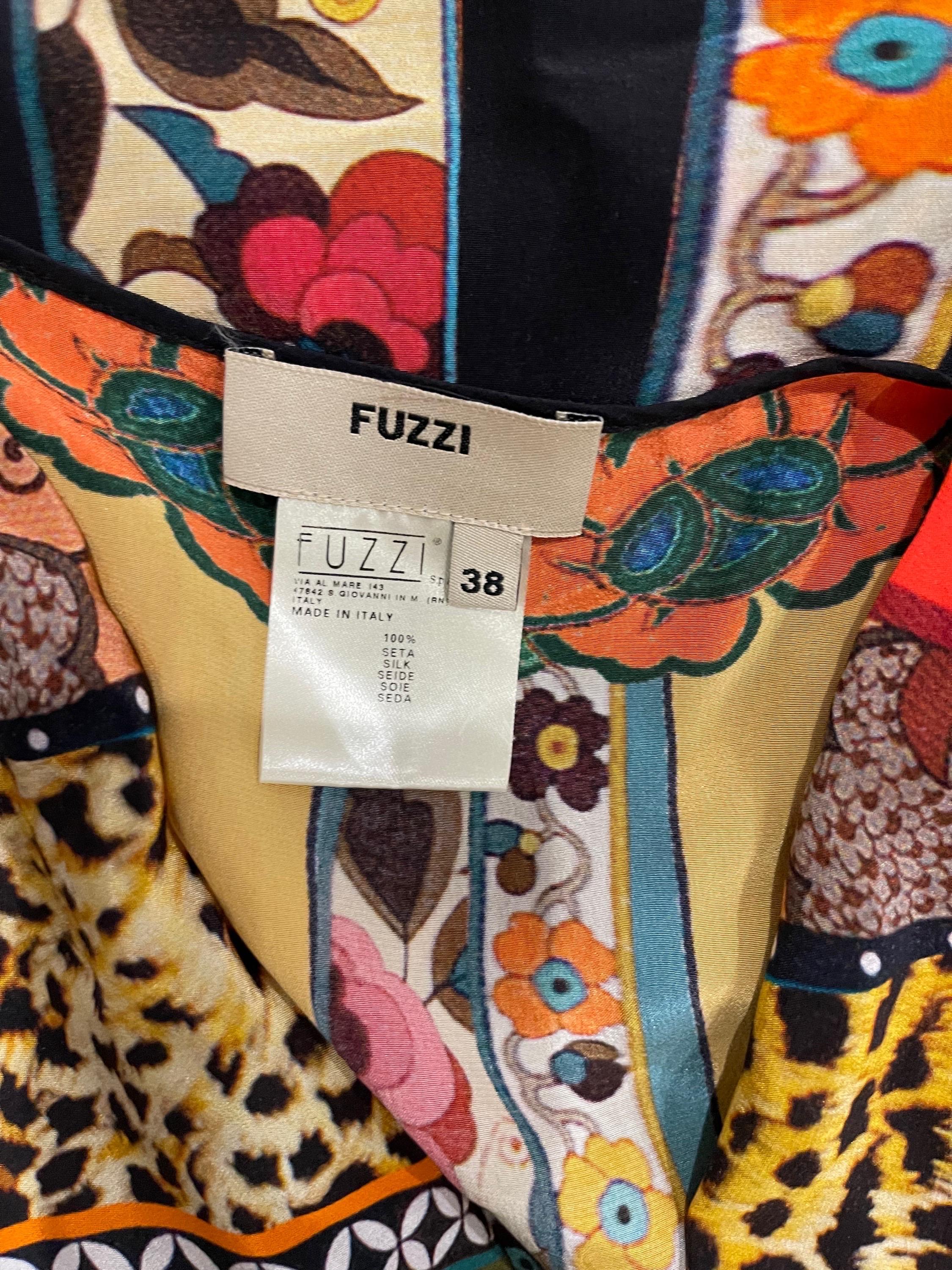 Amazing 1990s FUZZI mixed media silk top ! Features vibrant colors of orange, yellow, green, purple, red and pink throughout. Prints of belts, leopard / cheetah, and flowers throughout. Cowl neck style. Simply slips over the head. Can be dressed up