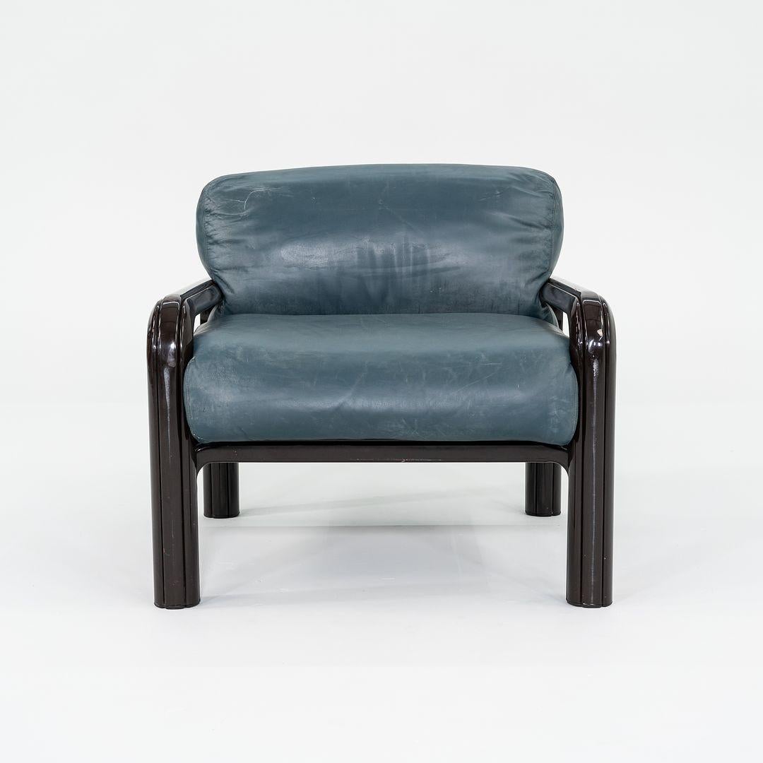 These are Aulenti Lounge Chairs, initially designed by Gae Aulenti for Knoll International in 1974 as part of the Aulenti Collection. The listed price includes one lounge chair, and we have 8 available for purchase. Their design features a dark