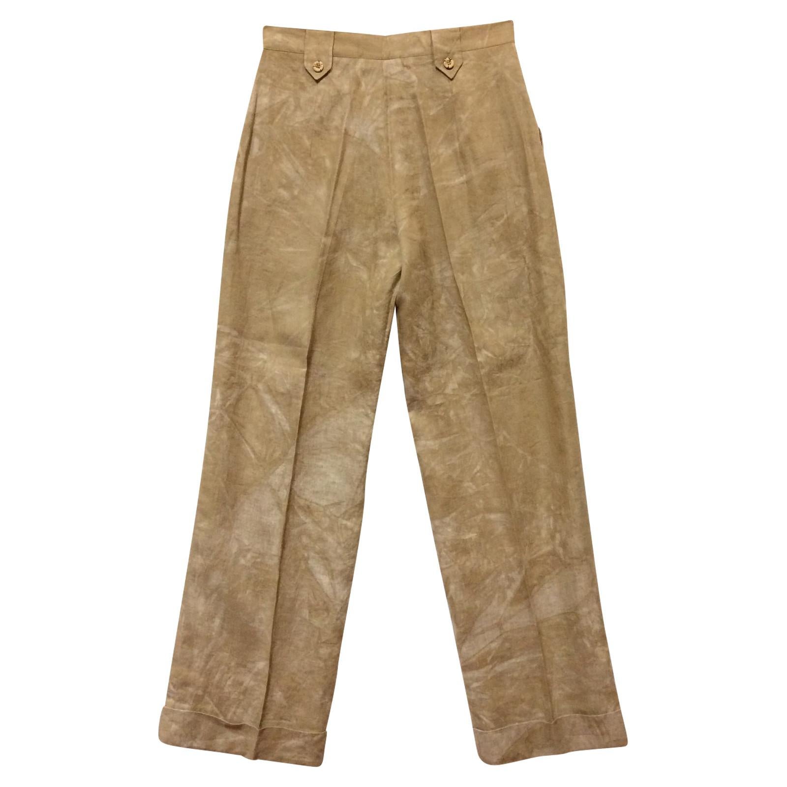 Gai Mattiolo beige linen trousers treated with tie dye technique. High waist, front zip and button closure. Welt pockets, pleats at the waist and turn-up at the bottom.

Years: 90s

Made in Italy

Size: 50 IT

Flat measurements
Lenght: 116 cm
Waist: