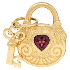 1990's Garnet 14 Karat Yellow Gold Vintage Lock & Key Pendant Charm