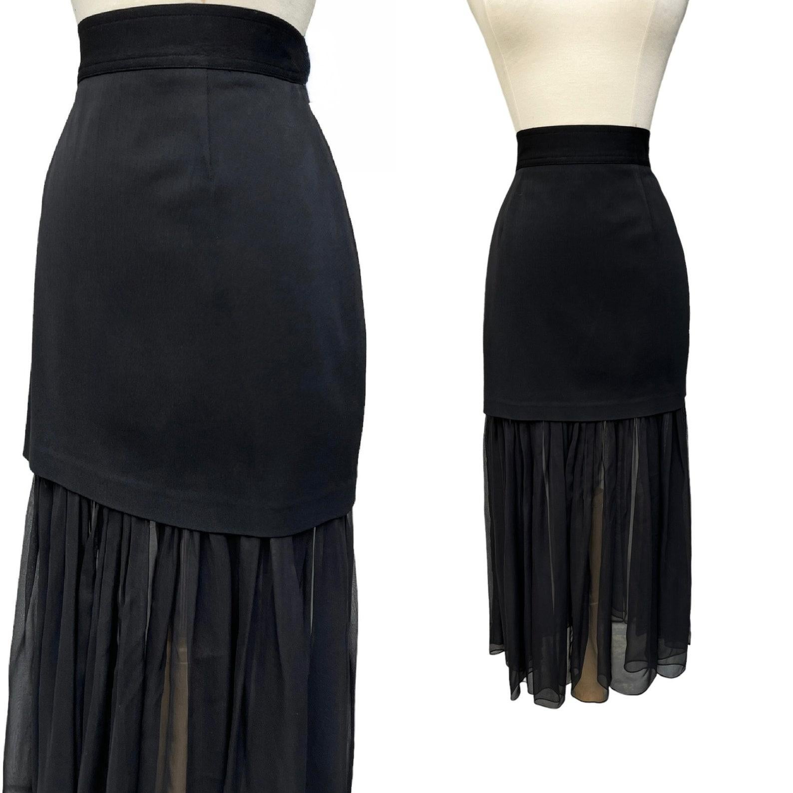 vintage black high waist skirt. mini length solid rayon with attached flowy sheer silk chiffon hem. fitted waist. single button + zip closure at back waist. dry cleaned.

Circa 1990s
Gemma Kahng New York
Made in the USA
Tagged Size