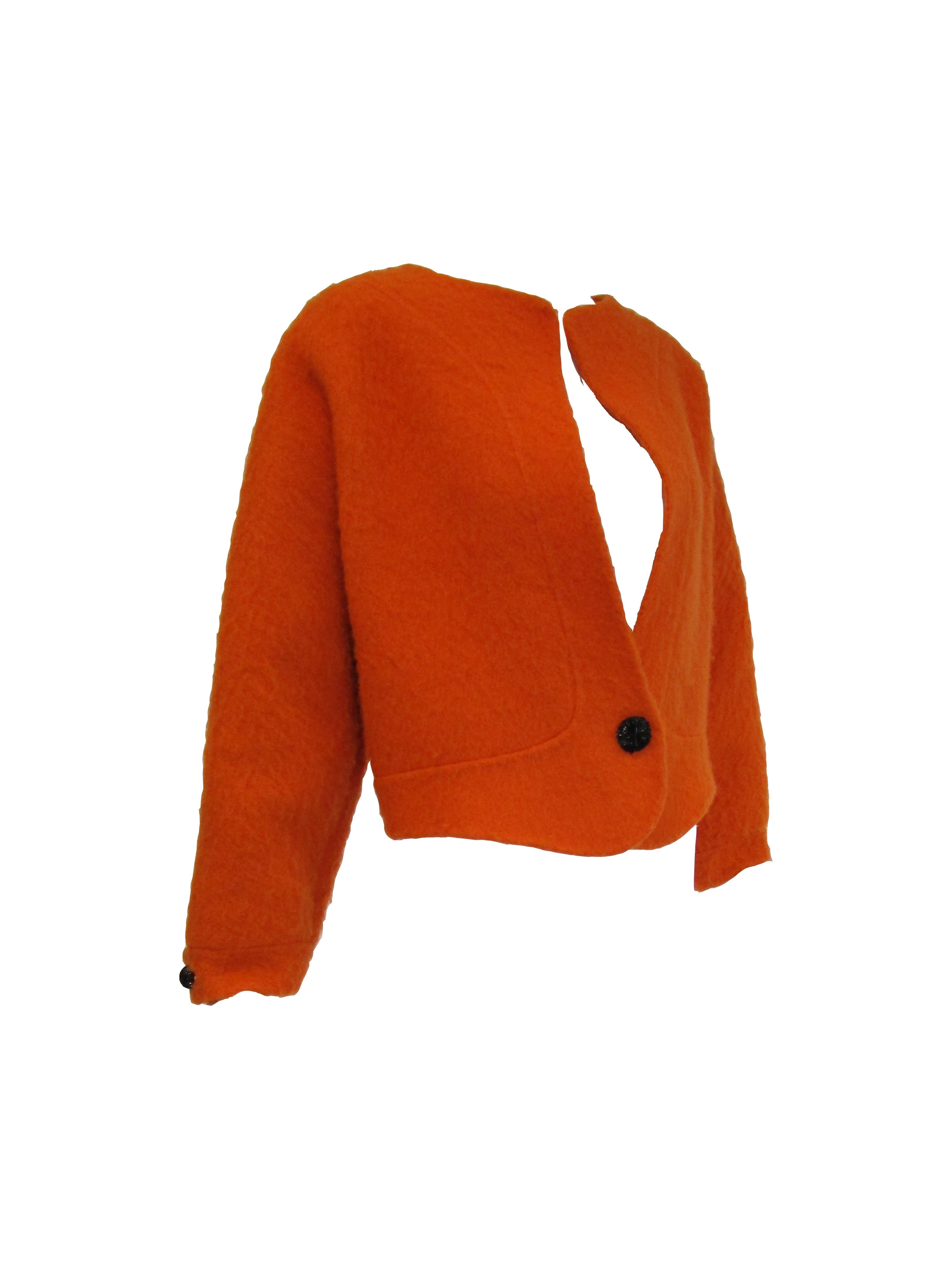 Fun and playful orange mohair jacket by Geoffrey Beene! 
This  intriguingly paneled jacket features a slightly cropped, boxy silhouette and wide sleeves.
Mohair is warm, proving to be a great option for the winter! 
You can be cozy, warm and