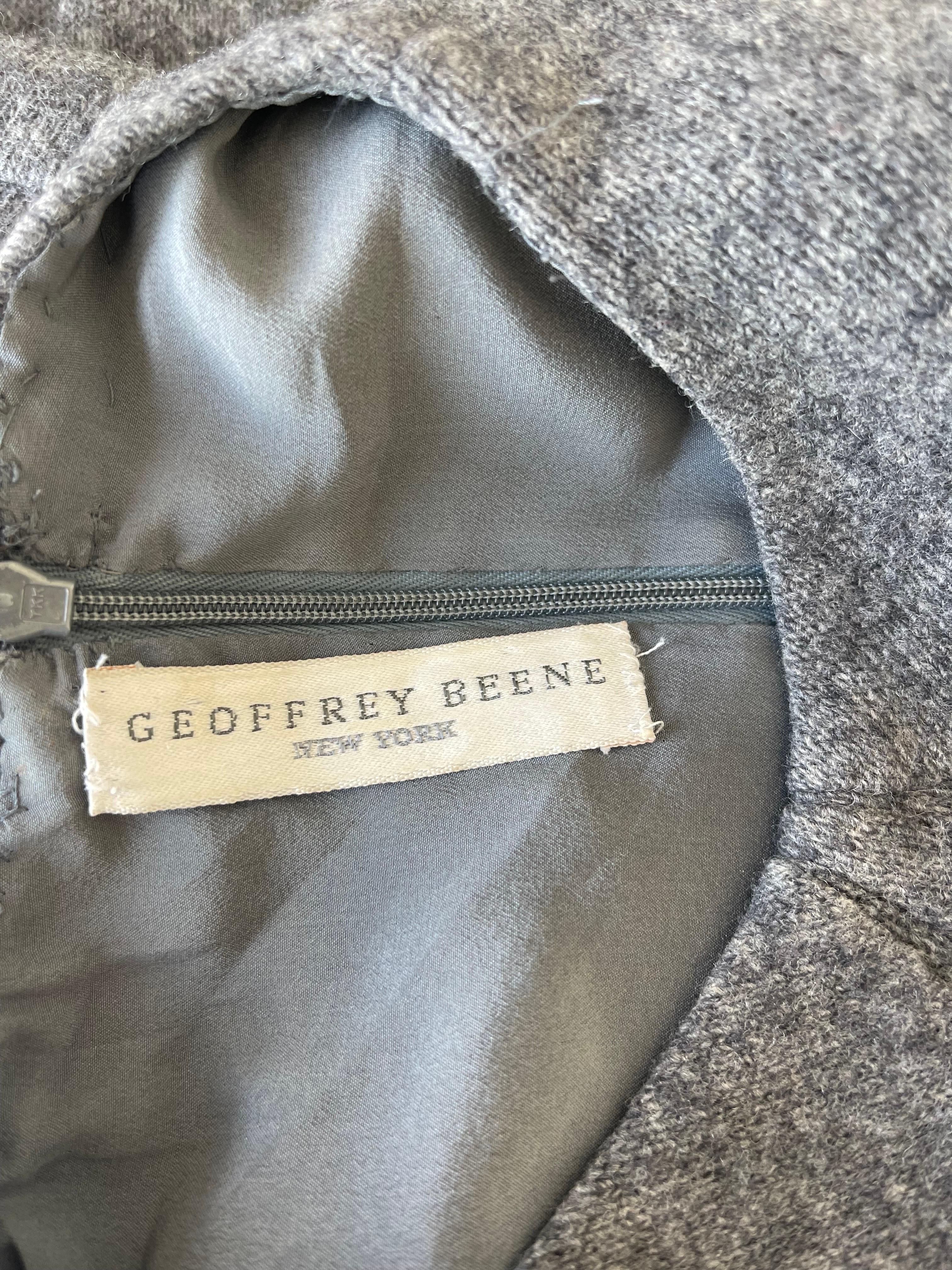 Chic 1990s GEOFFREY BEENE grey wool long sleeve dress ! This is so much more than just a grey dress. This special beauty has so many flattering lines. Couture quality, with the majority of finishings completed by hand. Tailored bodice with hidden