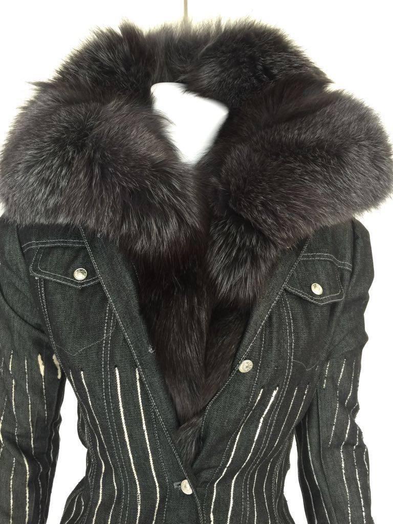 This stunning jacket is created and designed by Gianfranco Ferrè. A black denim jacket with a wrap long silver fox fur. The collar is detachable. 