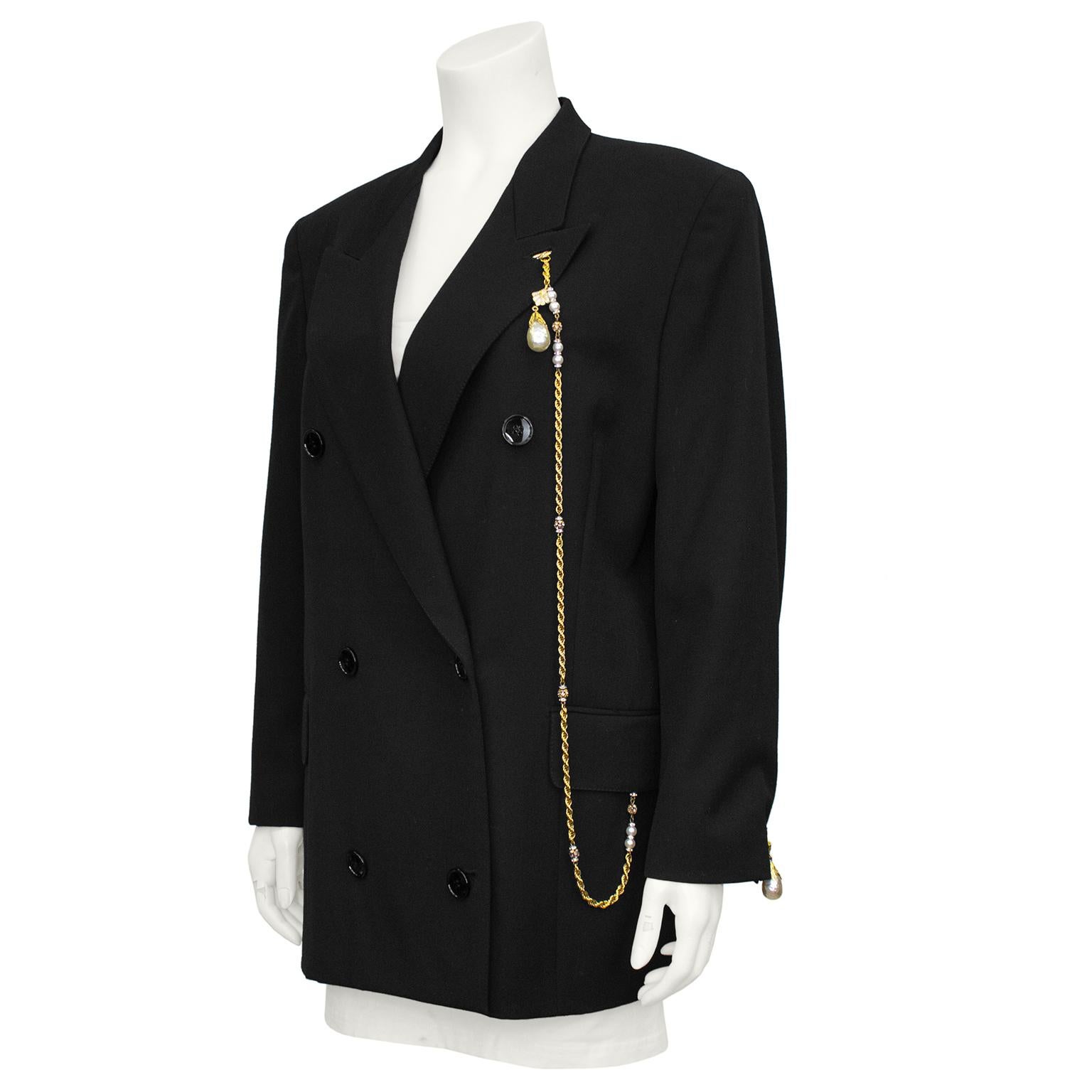 1990s Gianfranco Ferre double breasted black wool blazer. Features long gold tone, rhinestone and pearl chain with large teardrop shaped Baroque pearl that fastens at left side of the collar and clips under the left flap pocket with a lobster clasp.