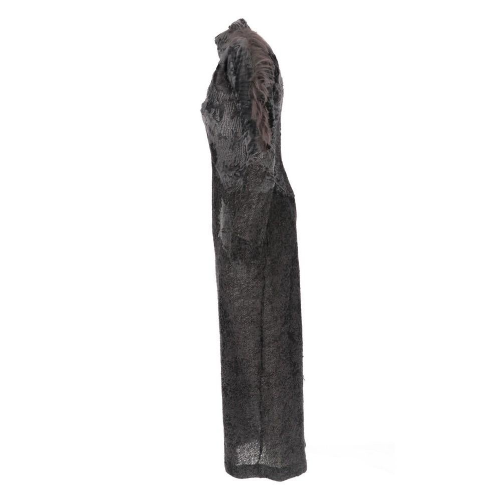 Gianfranco Ferré dark grey alpaca, mohair and wool blend long dress, with tone-on-tone persian lamb fur inserts and kiddassia tufts on the left shoulder and sleeve. High collar, rear concealed zip fastening and bottom slit.

Size: 44 IT

Flat