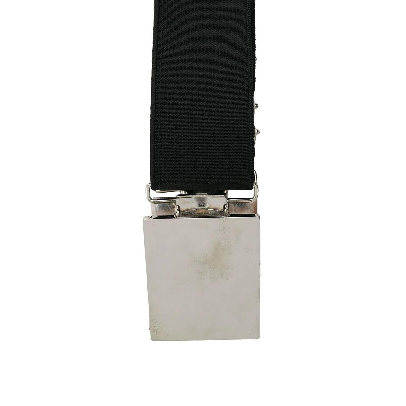 Gianfranco Ferré black stretch fabric braces, model composed by two shoulder straps. Silver metal details.

The product has oxidized and slightly scratched metal parts as shown in the pictures.


Years: 90s

One Size