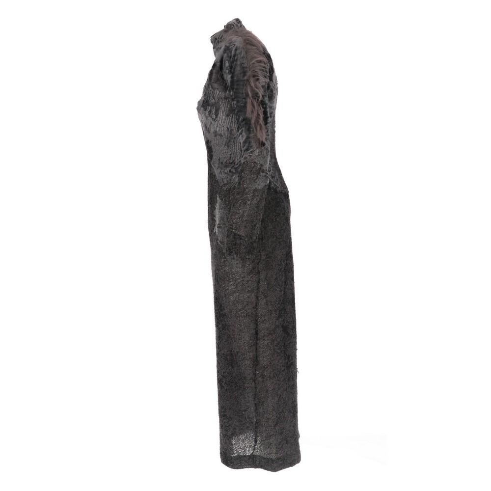 Gianfranco Ferré dark grey alpaca, mohair and wool blend long dress, with tone-on-tone persian lamb fur inserts and kiddassia tufts on the left shoulder and sleeve. High collar, rear concealed zip fastening and bottom slit.
This item comes from a