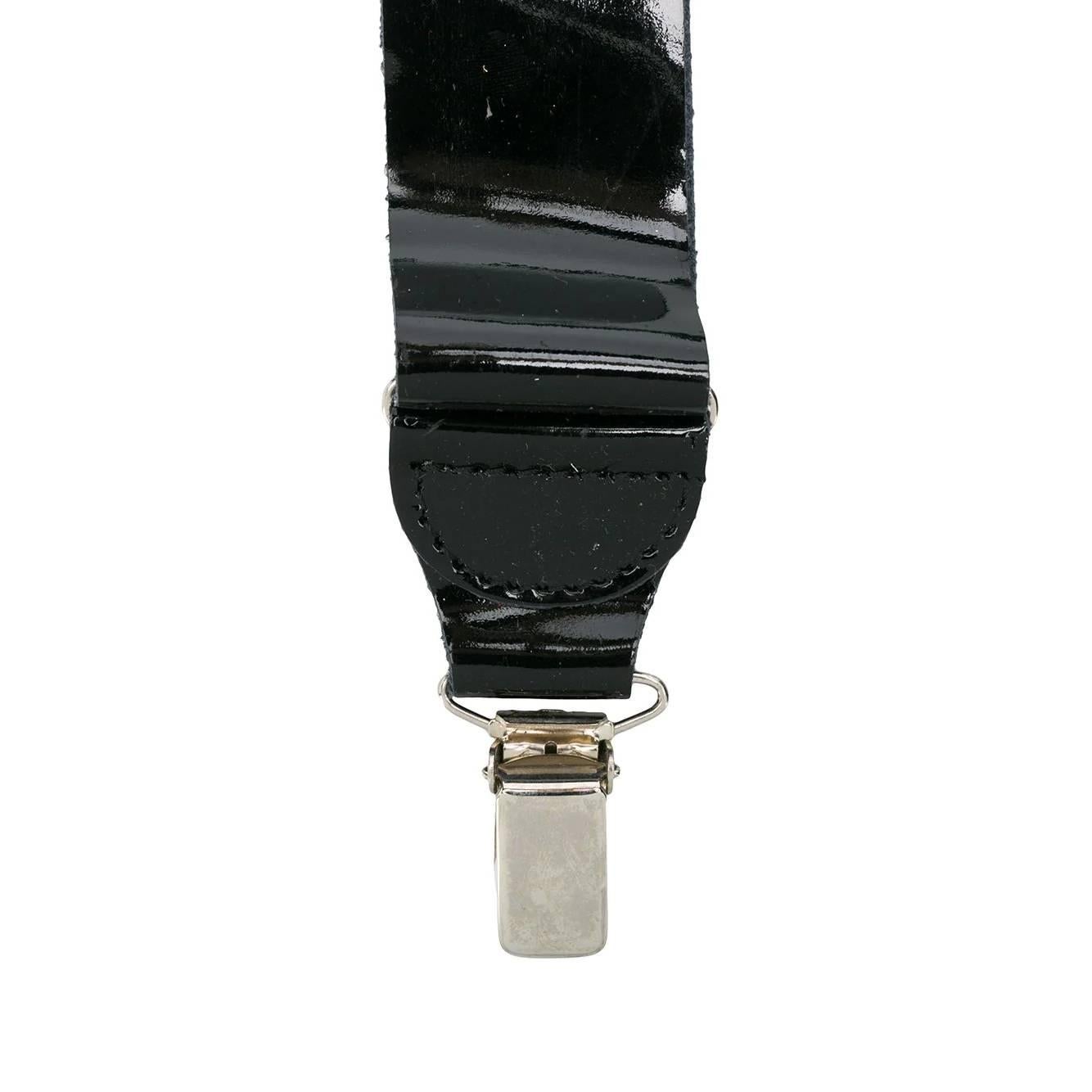 A.N.G.E.L.O. Vintage - ITALY
Gianfranco Ferré black patent leather braces. Silver metal details.

The product has some signs of wear as shown in the pictures.

Years: 90s

One Size