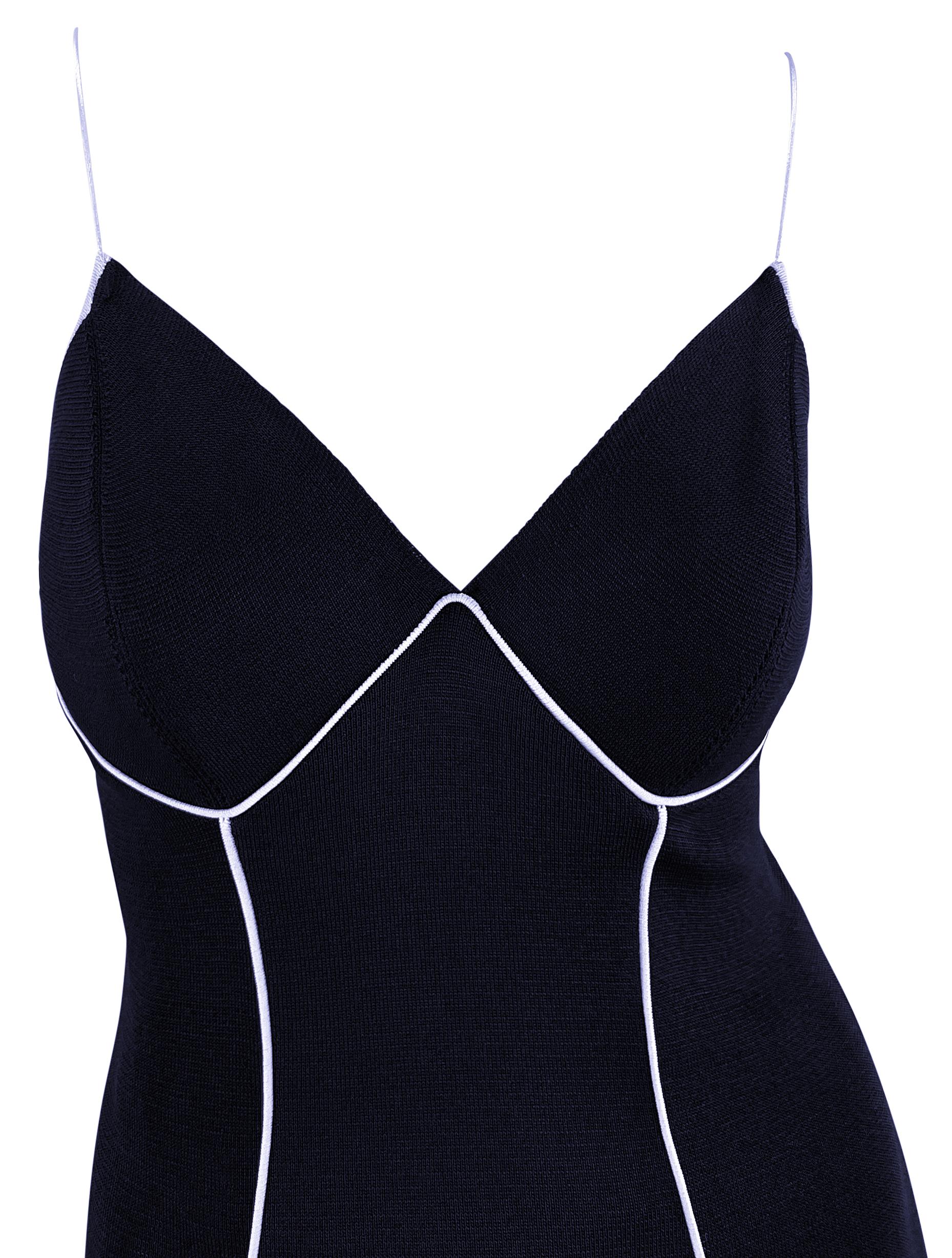 From the 1990s, this gorgeous navy blue Gianfranco Ferré slip dress is the perfect classic bombshell dress. This chic, form-fitting dress features a princess neckline, spaghetti straps, a below-the-knee hem, and a semi-exposed back. The white straps
