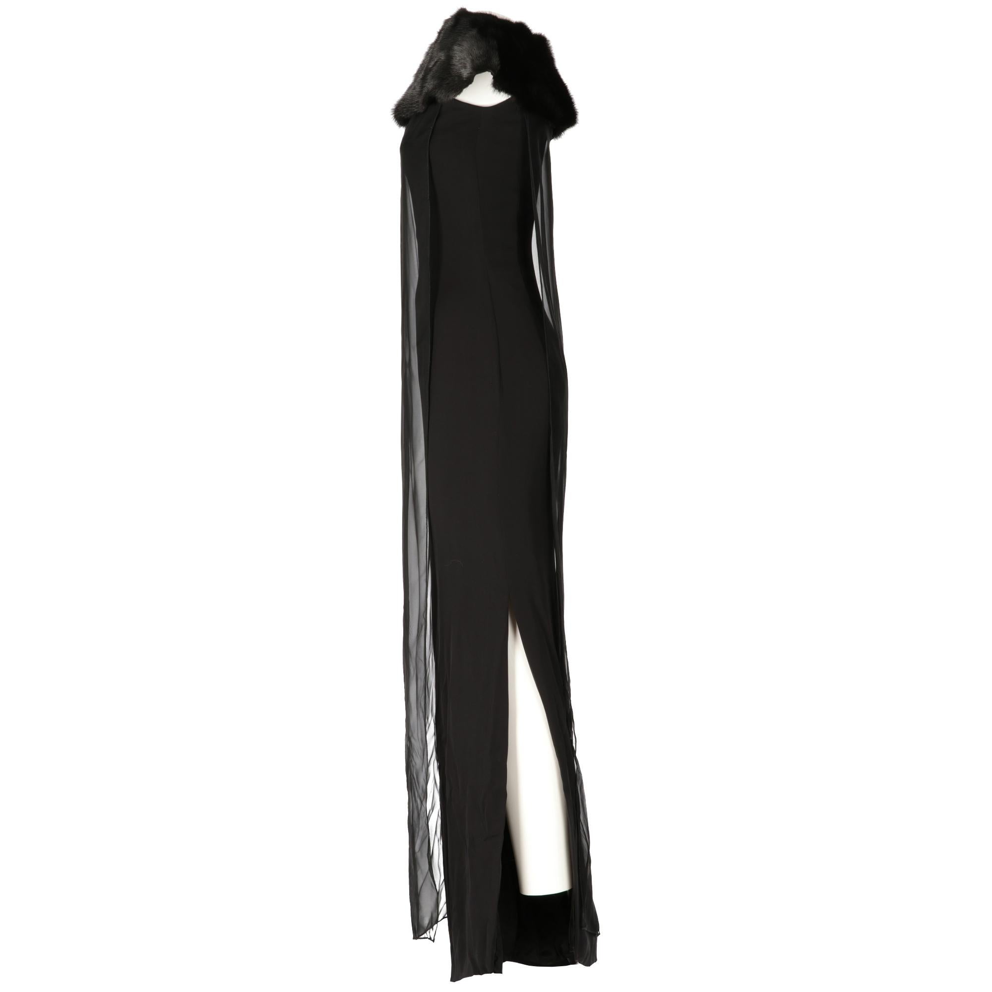 Long sleeveless Gianfranco Ferrè dress in opaque black silk with a top veil in chiffon, with collar in real mink fur, slit on the left side, central fastening on the back with invisible zip, hooks on the neck and snap buttons on the external veil,