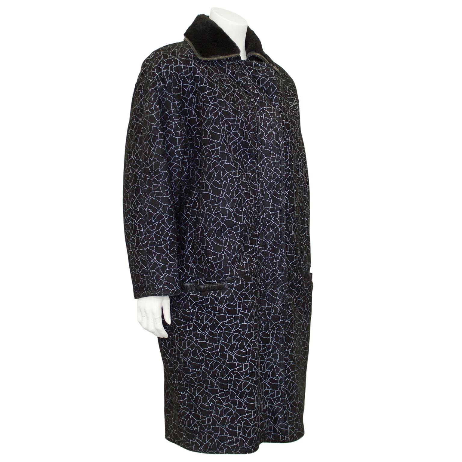 Gianni Versace shearling coat from the 1990s. Black suede with all over contrasting white crackle style print. Slight cocoon shape with dolman sleeves and horizontal slit pockets with black leather trim. Black shearling interior and collar with