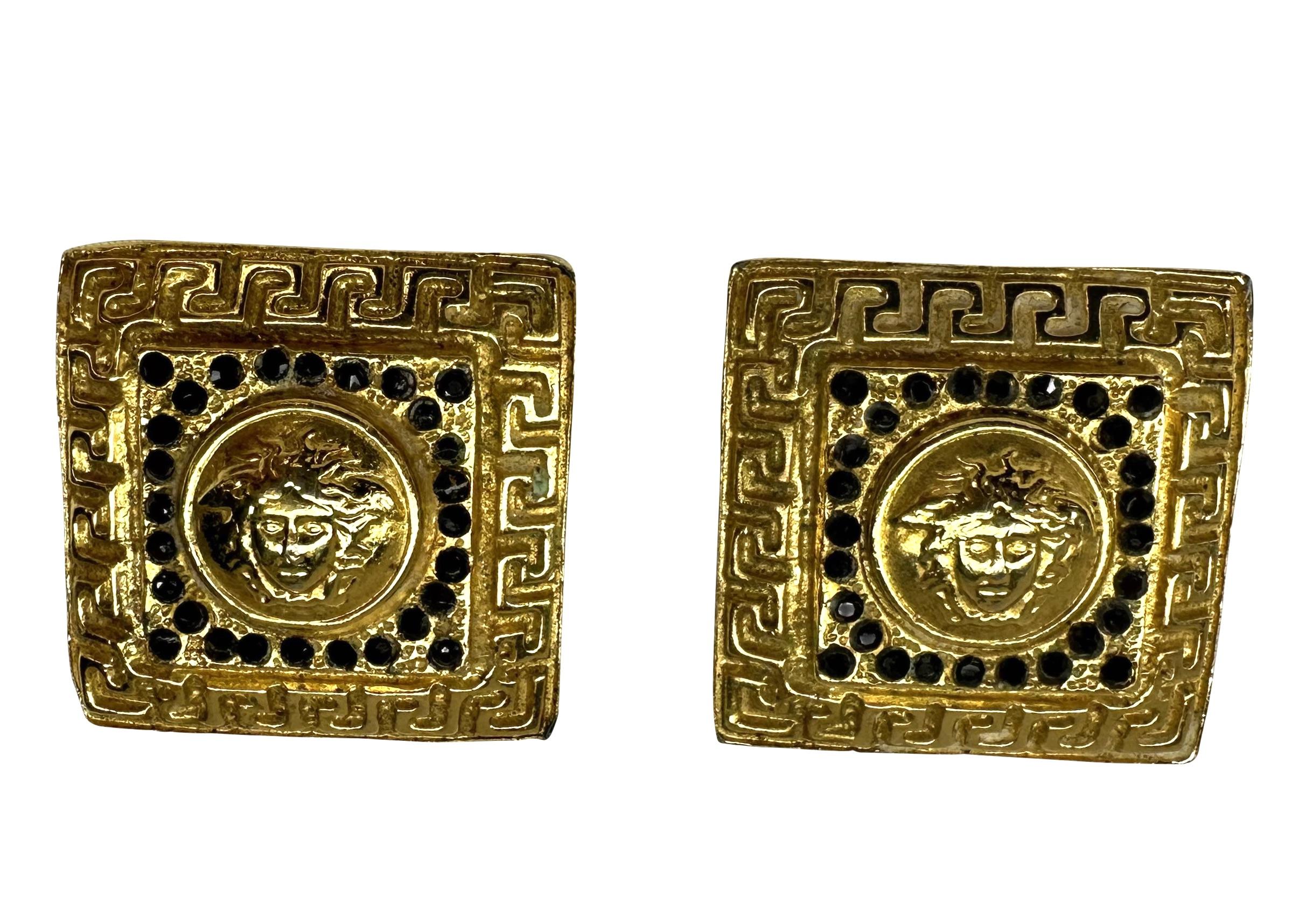 Presenting a pair of large gold-tone Gianni Versace Medusa clip-on earrings, designed by Gianni Versace. From the 1990s, these fabulous large square earrings feature a Greek key border and are made complete with a large Versace Medusa logo