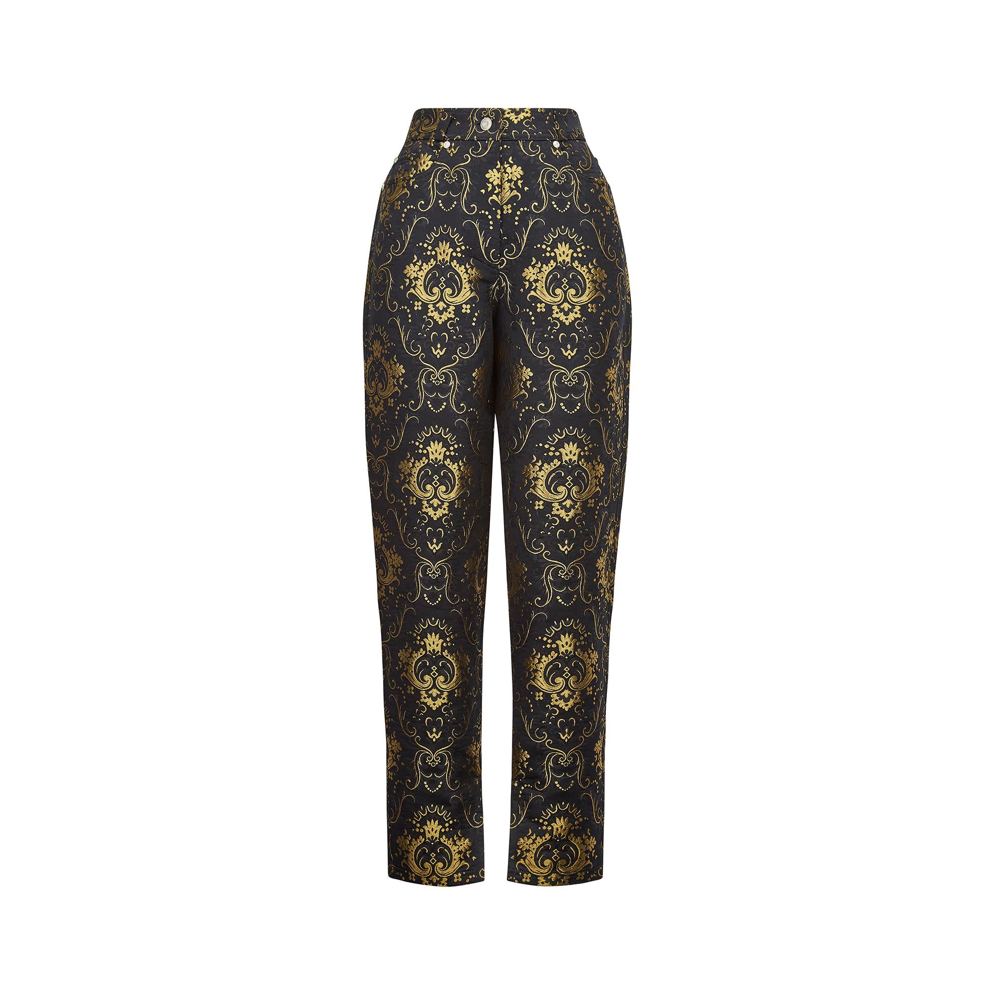 Superb 1990s Gianni Versace high rise and tapered trouser jeans designed when Gianni himself was at the creative helm. From his high-end couture collection, these date to 1995 and are in a black and gold metallic silk blend brocade featuring the