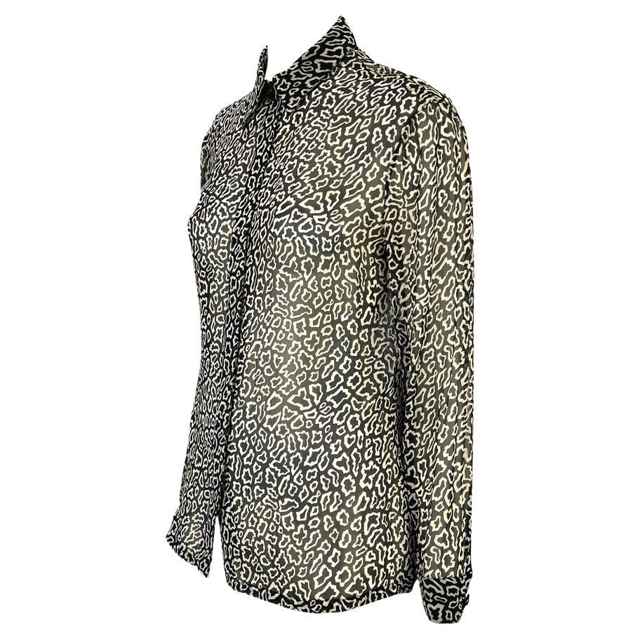 Presenting a black and white animal print Gianni Versace Couture sheer button up shirt, designed by Gianni Versace. This top is constructed entirely of light semi-sheer silk with animal print throughout and is the perfect Versace addition to any