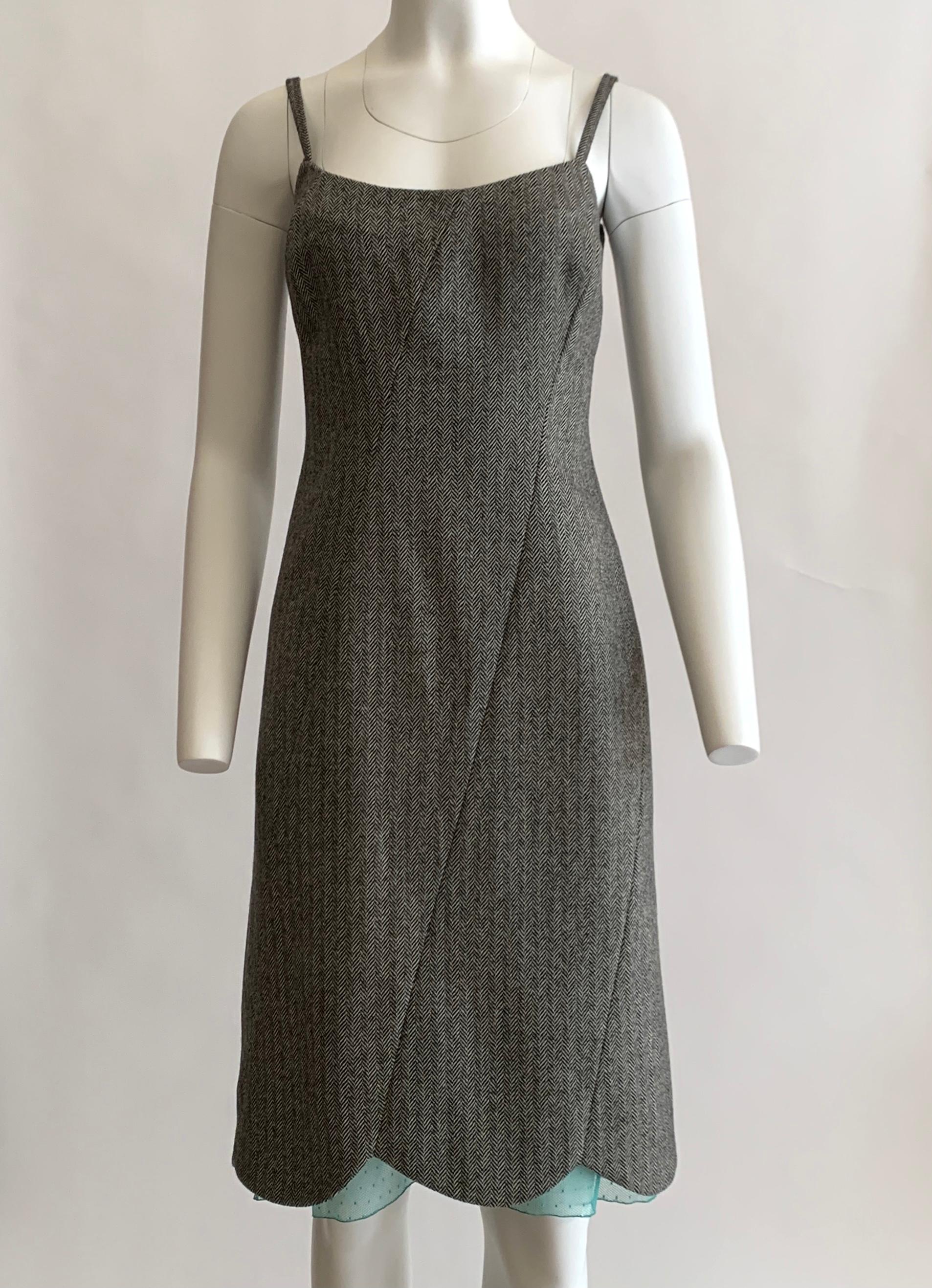 Vintage Gianni Versace Couture black and white  herringbone tweed dress. 90s slip dress style in an unexpected suiting fabric. Bright robin's egg blue lace peeks out from the scalloped hem and at back slit. Back zip follows diagonal seam. 

80%