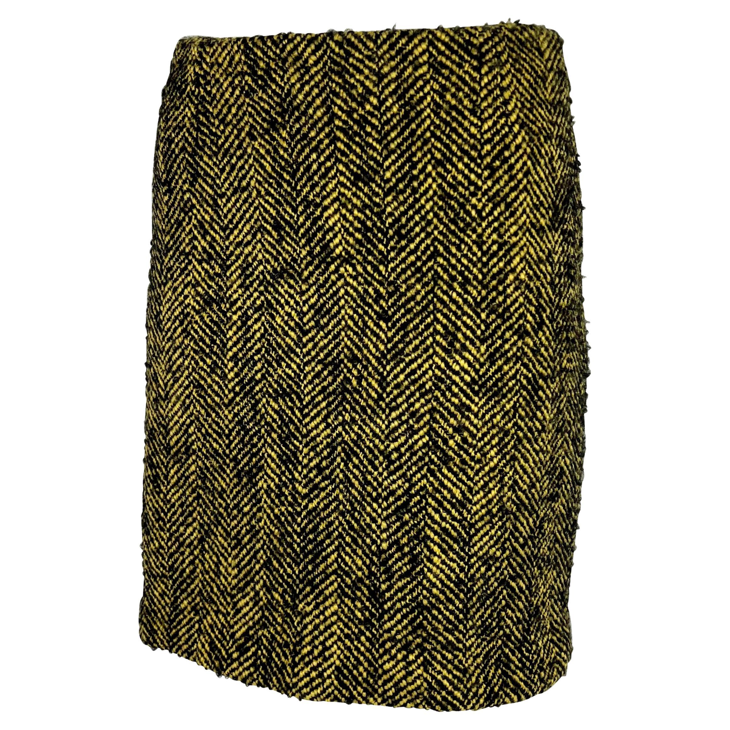 Presenting a black and yellow tweed Gianni Versace skirt, designed by Gianni Versace. From the mid 1990s this wool skirt features a chevron pattern throughout. 

Approximate measurements:
Size - 42IT/8US
Waistband to hem: 18