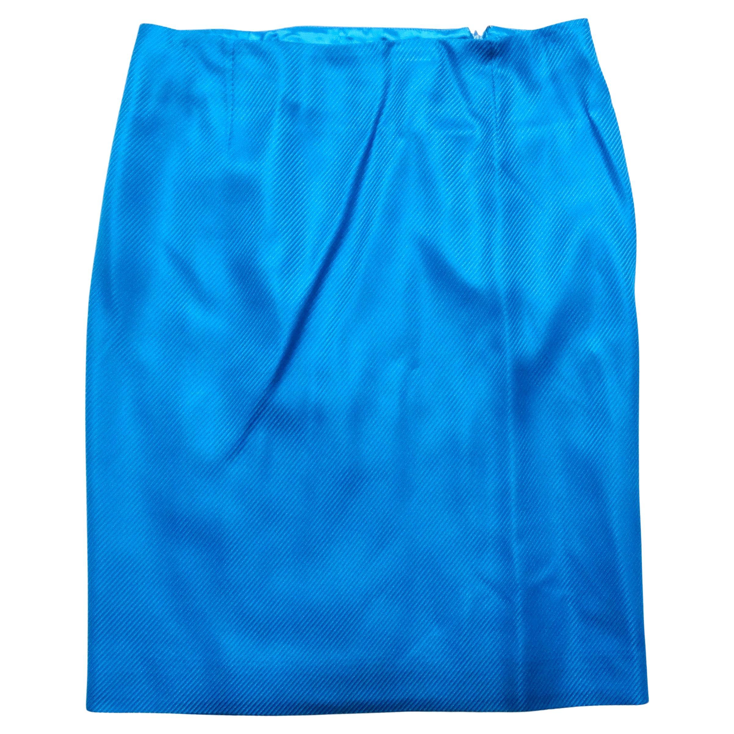 Step into the glamour of the '90s with this stunning Gianni Versace Couture Bright Blue Silk Top and Skirt Set. This iconic ensemble features a beautifully crafted wrap-style top that ties elegantly, offering versatility and style for any occasion.
