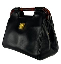 1990s Gianni Versace Couture Leather Medusa Relief Acrylic Frame Handle Mini Bag
