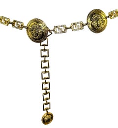 1990s Gianni Versace Gold Tone Rhinestone Greek Key Medusa Medallion Chain Belt