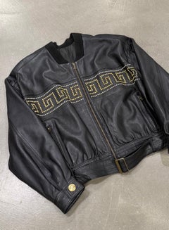 1990s Gianni Versace leather jacket with gold studs details