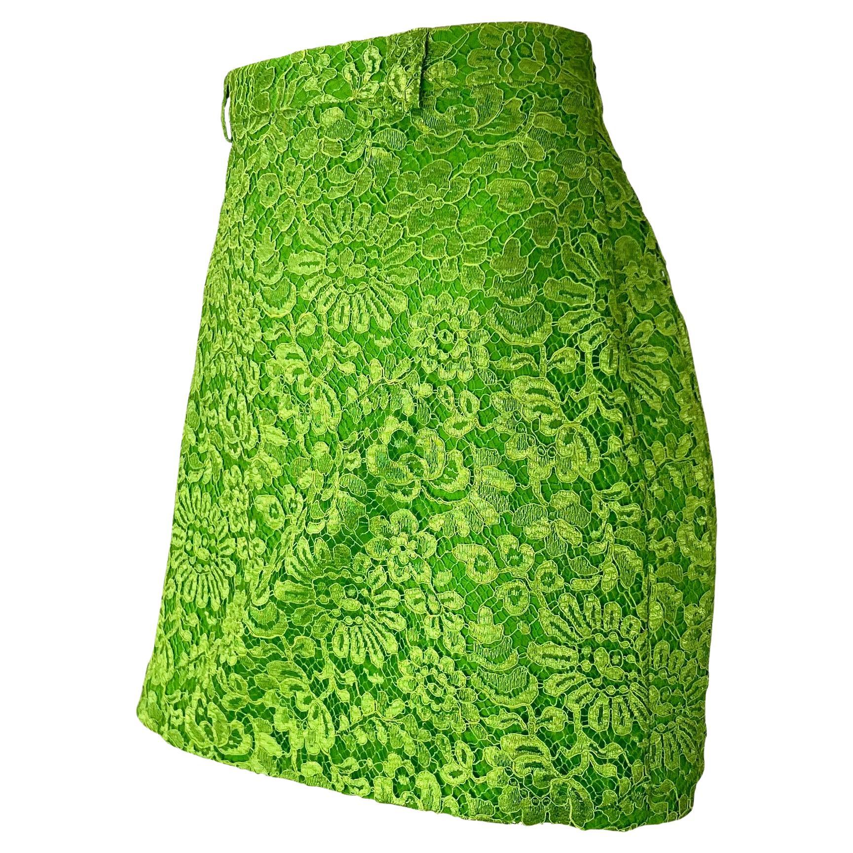 TheRealList presents: a bright lime green mini skirt designed by Gianni Versace in the mid-1990s. The tapered mini cut and neon color create an artful contrast between classic beauty and modernity. Easy to dress up or down, this versatile skirt is