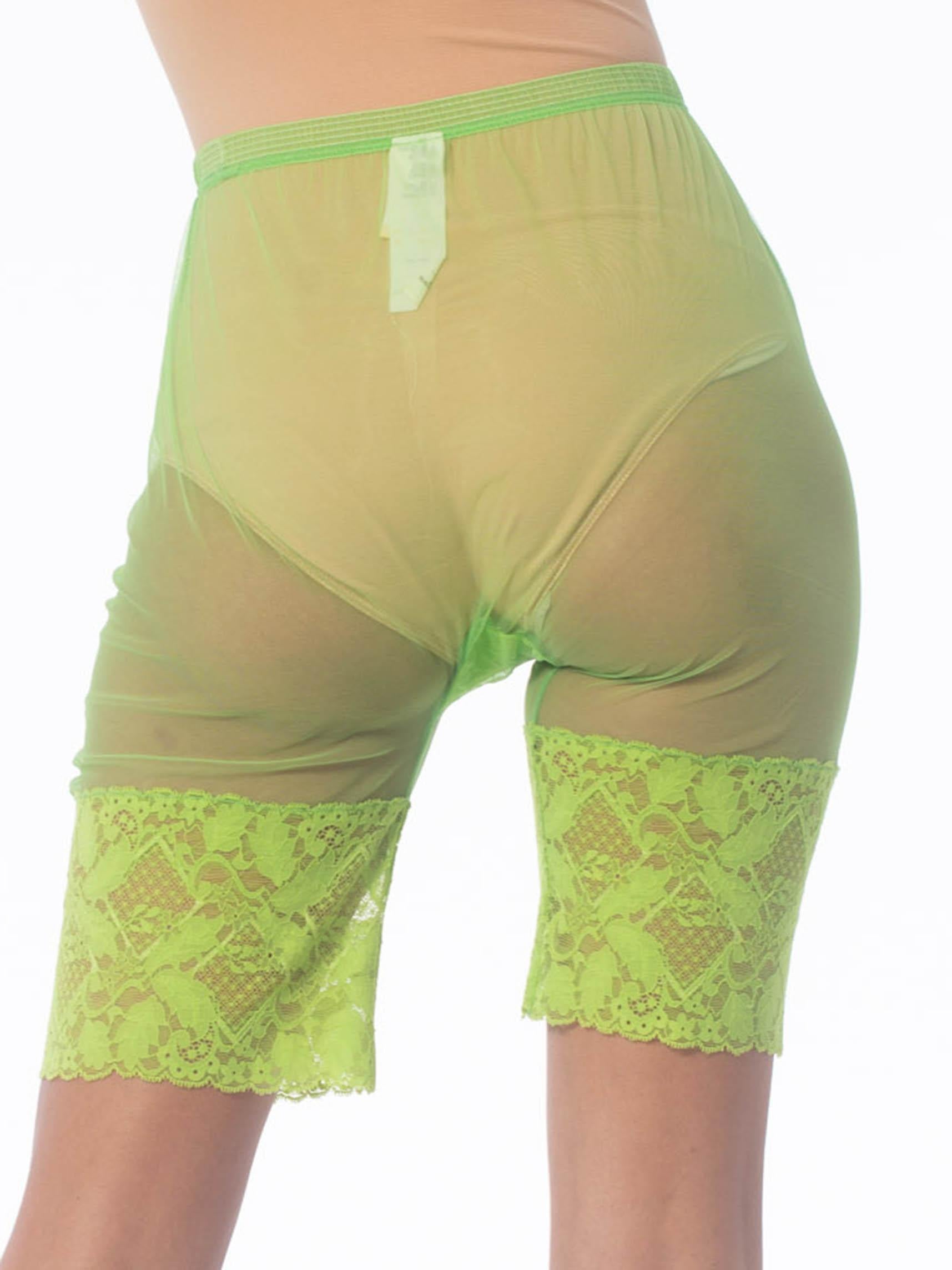 1990S GIANNI VERSACE Lime Green Nylon Net Sheer Bike Shorts With Lace Hem In Excellent Condition For Sale In New York, NY