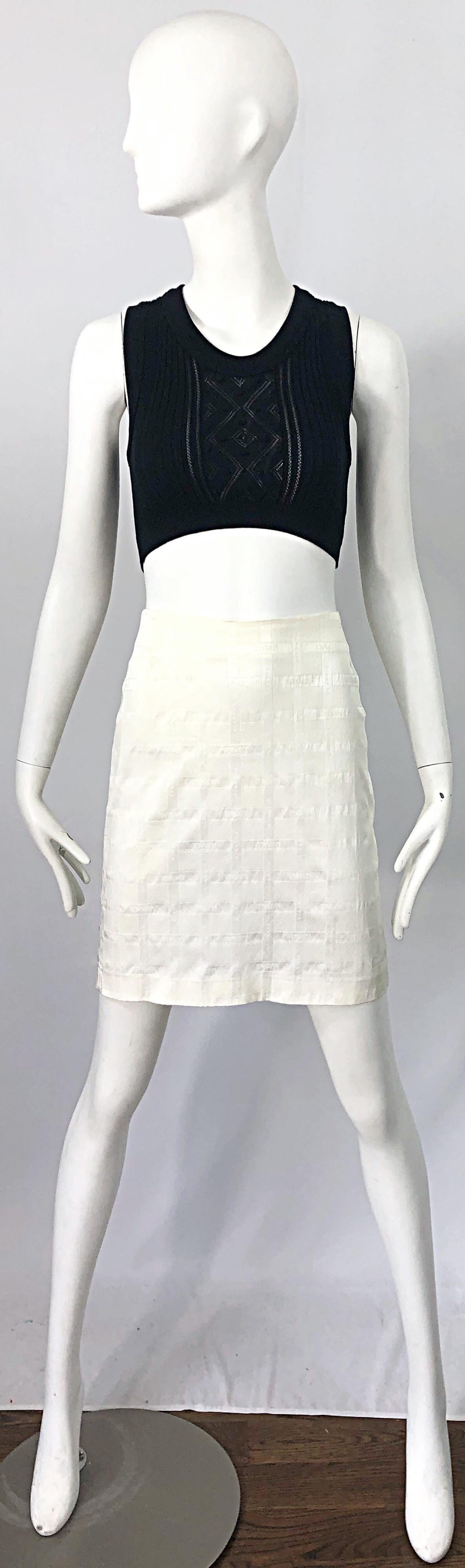 Sexy late 1990s GIANNI VERSACE white logo print high waist mini skirt! Features Squares that spell out Versace throughout. Hidden zipper up the back with hook-and-eye closure. Can easily be dressed up or down, day or evening. The pictured vintage