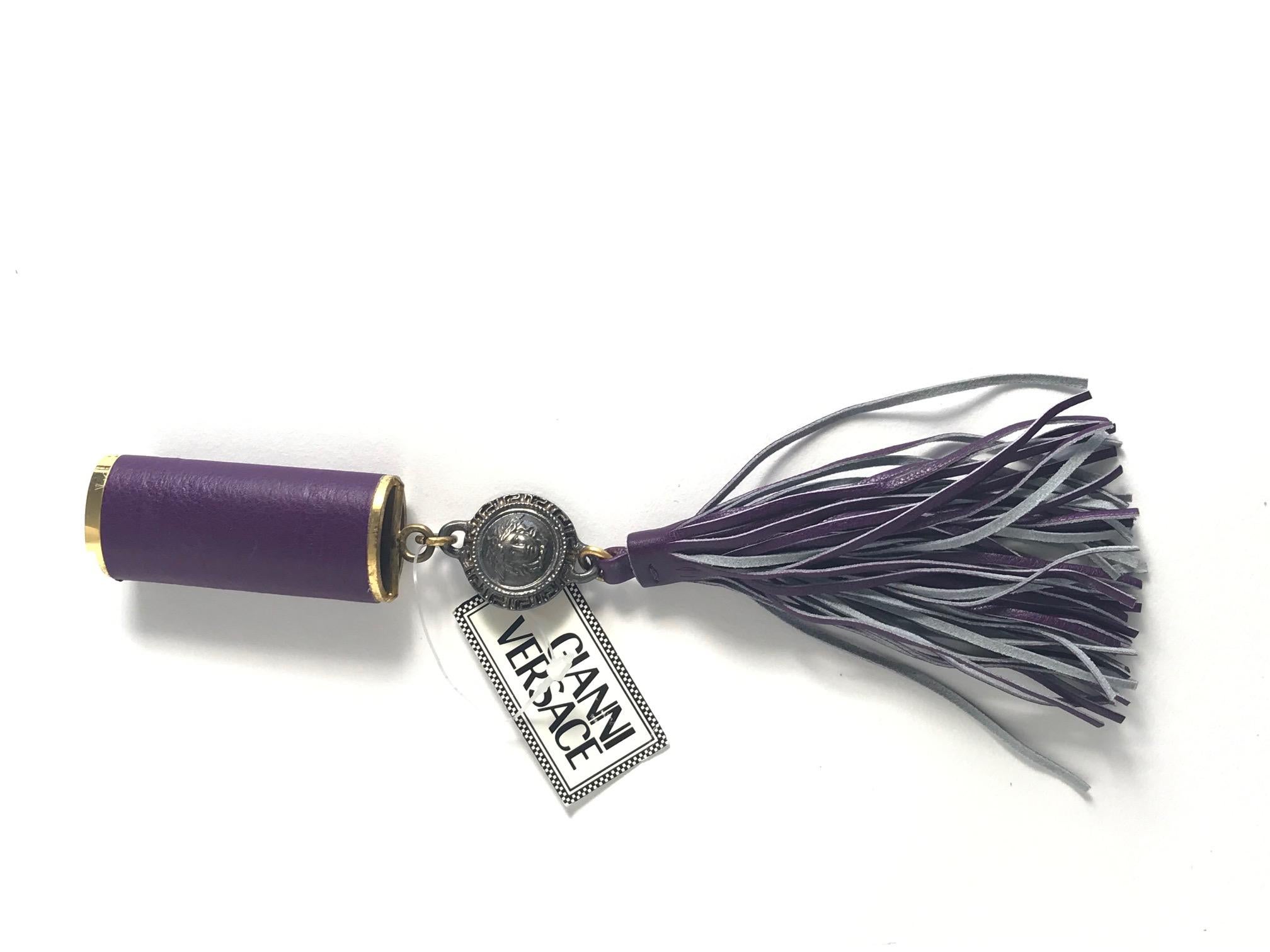 1990s Gianni Versace purple leather fringe lighter holder. Fits regular bic lighter. Condition: Excellent