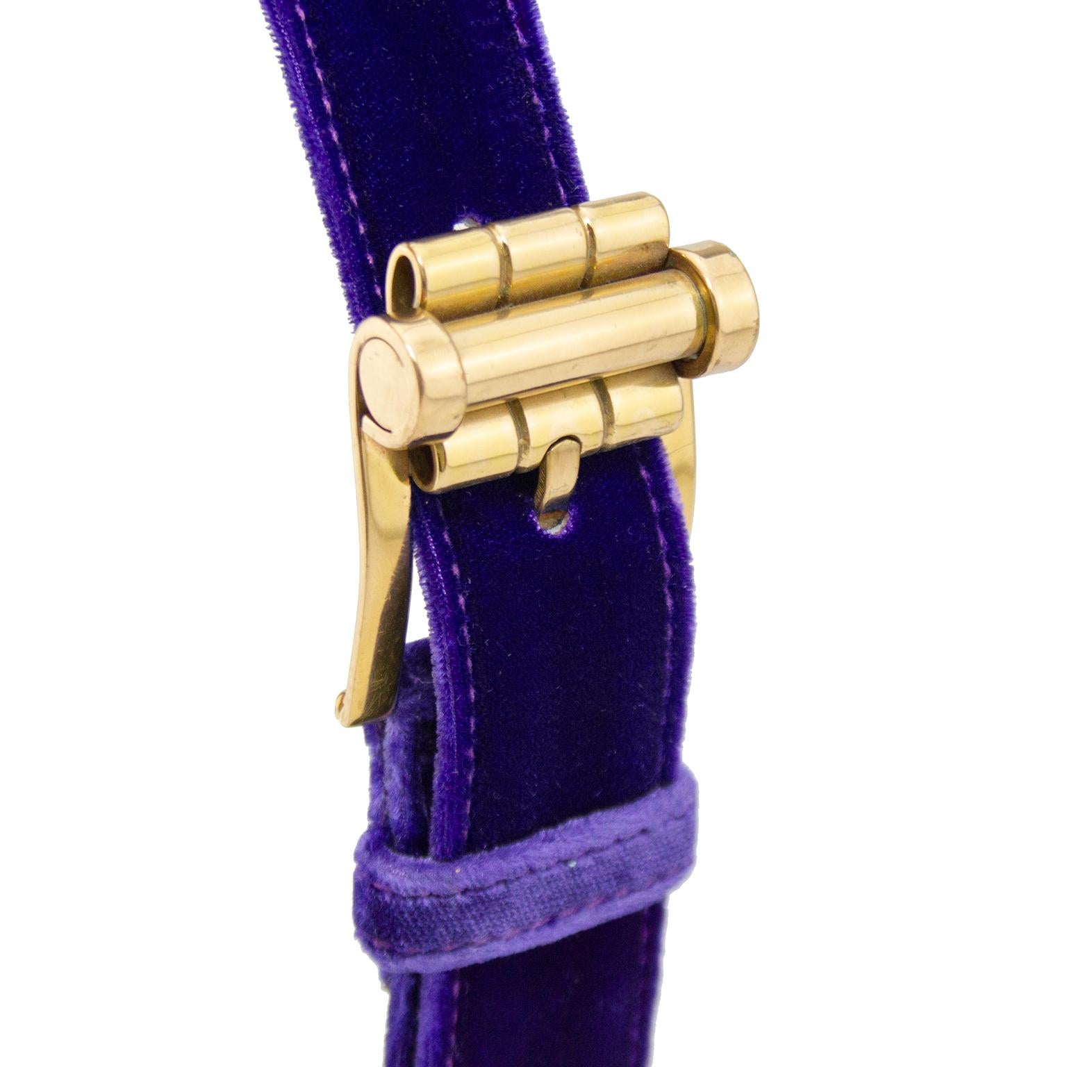 Gianni Versace belt from the early 1990s. Purple cut velvet with heavy gold tone hardware and large faux pearls. Interesting details on buckle. Tonal purple top stitching. Black leather interior with gold brand stamp. Excellent vintage condition.