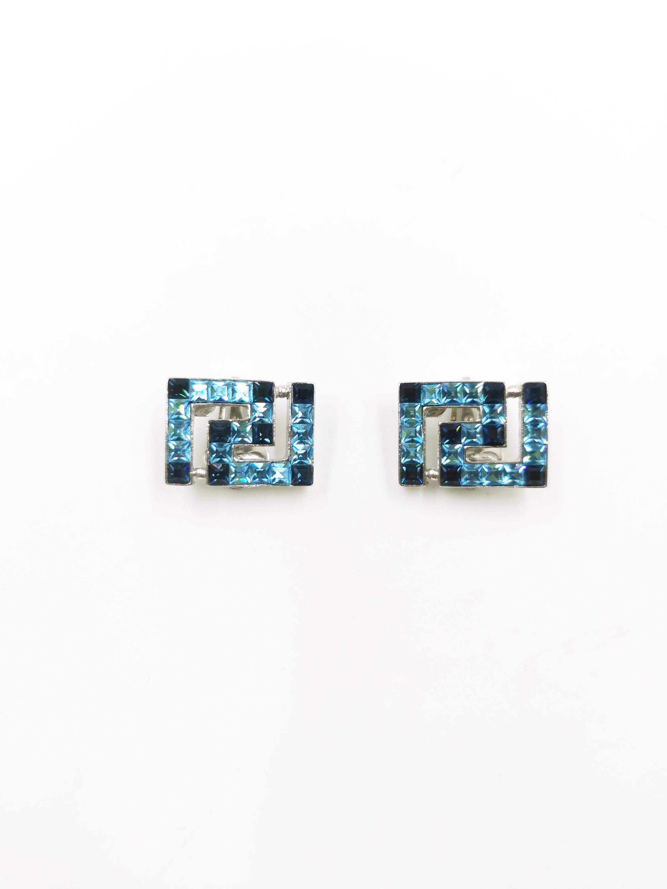 Vintage Gianni Versace Greca shape Earrings in Blue, this brand new vintage item still in original box is not to be seen elsewhere. A versace collector piece!

Feature
Material: Silver and Blue Rhinestones
Condition: Mint Old Stock
Colour: Silver