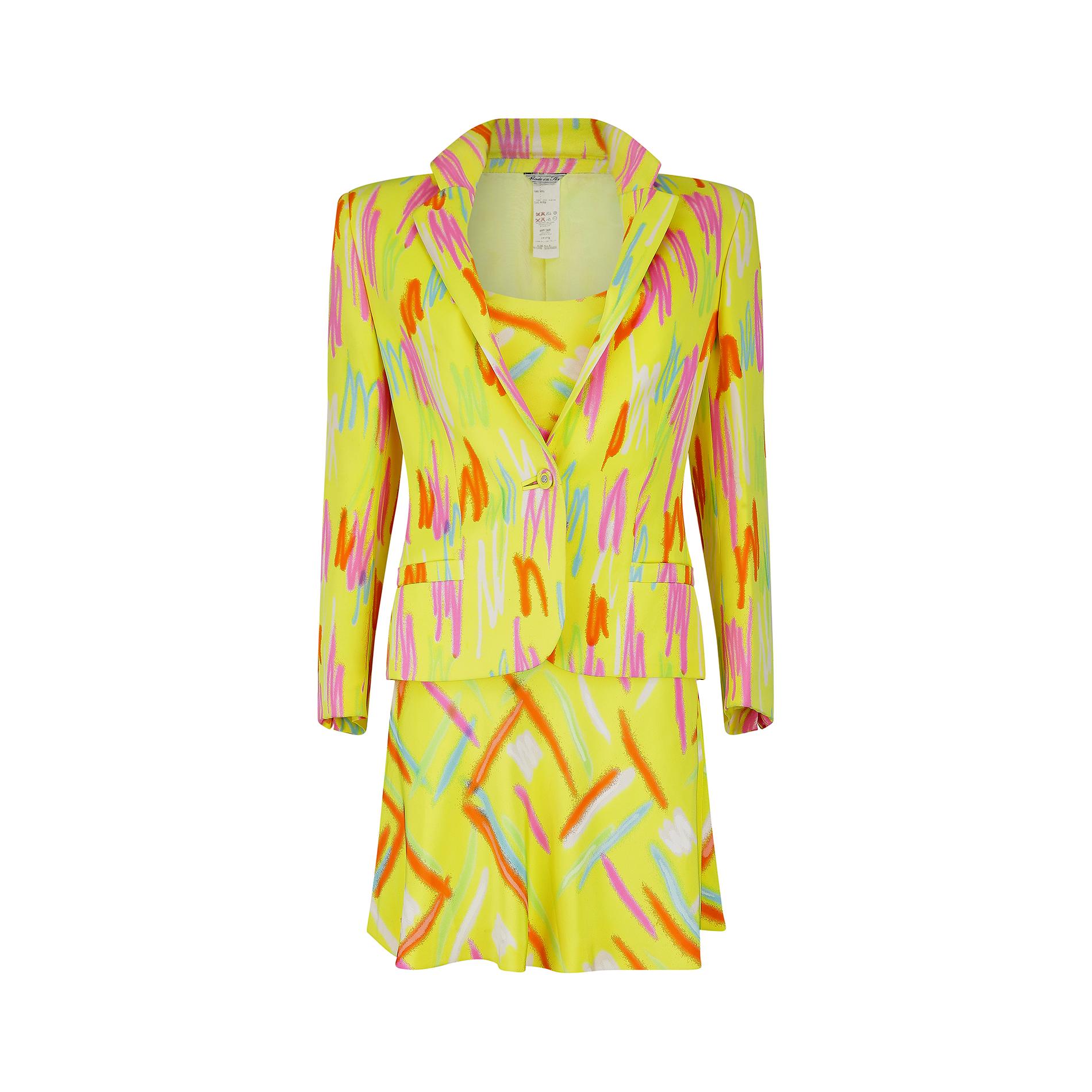 Neon hued dress suit by Gianni Versace Couture which featured in the Spring 1996 ready-to-wear collection, Look number 50. Both the jacket and the dress are made using a beautifully soft silk, in a striking abstract design against a yellow