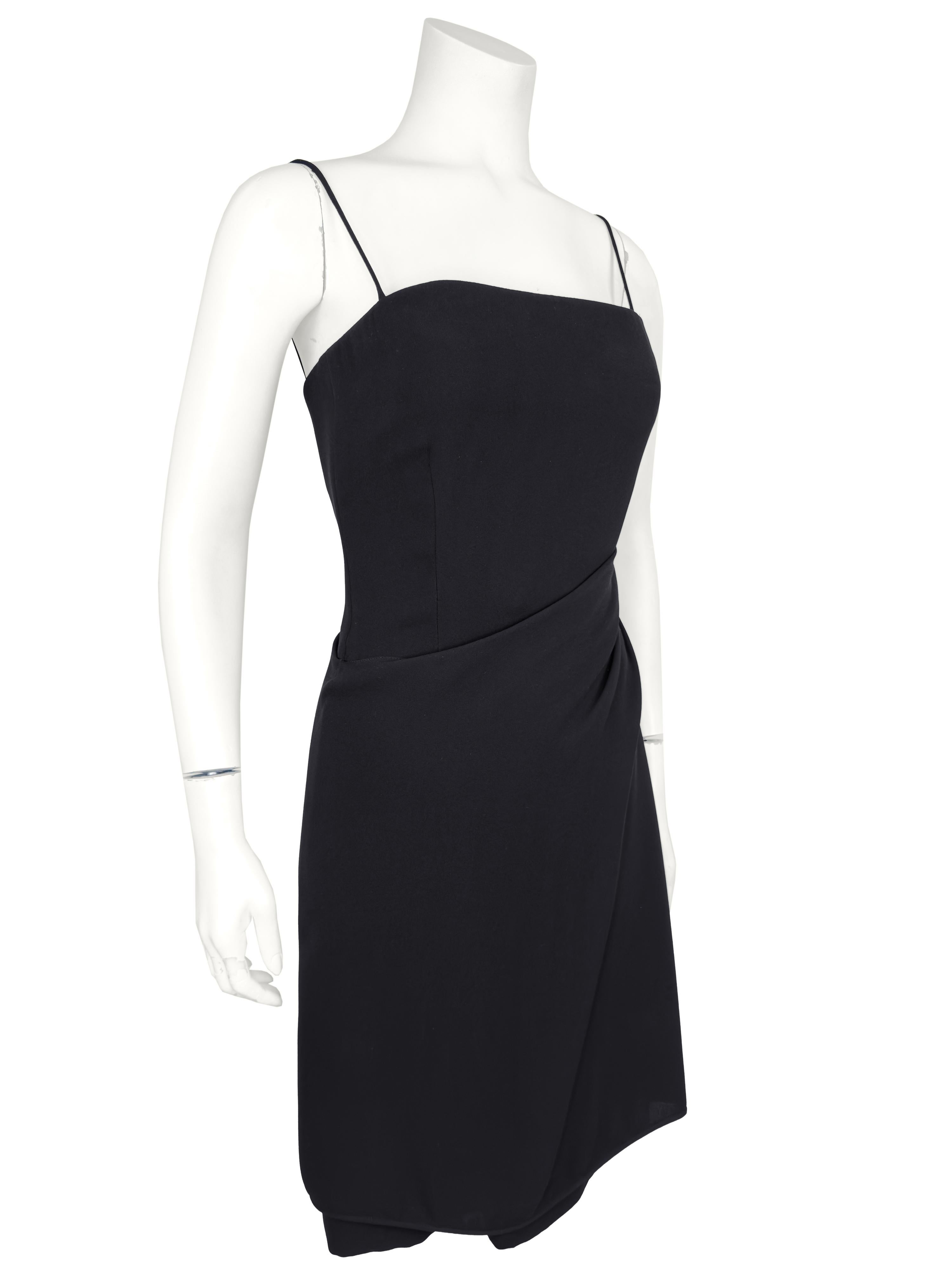 A classic never goes out of style. This Armani silk LBD from the 1990s is the perfect example. Beautifully constructed with an interior boned corset bodice that fastens with a hook and zips up the left side. The dress has spaghetti straps and a