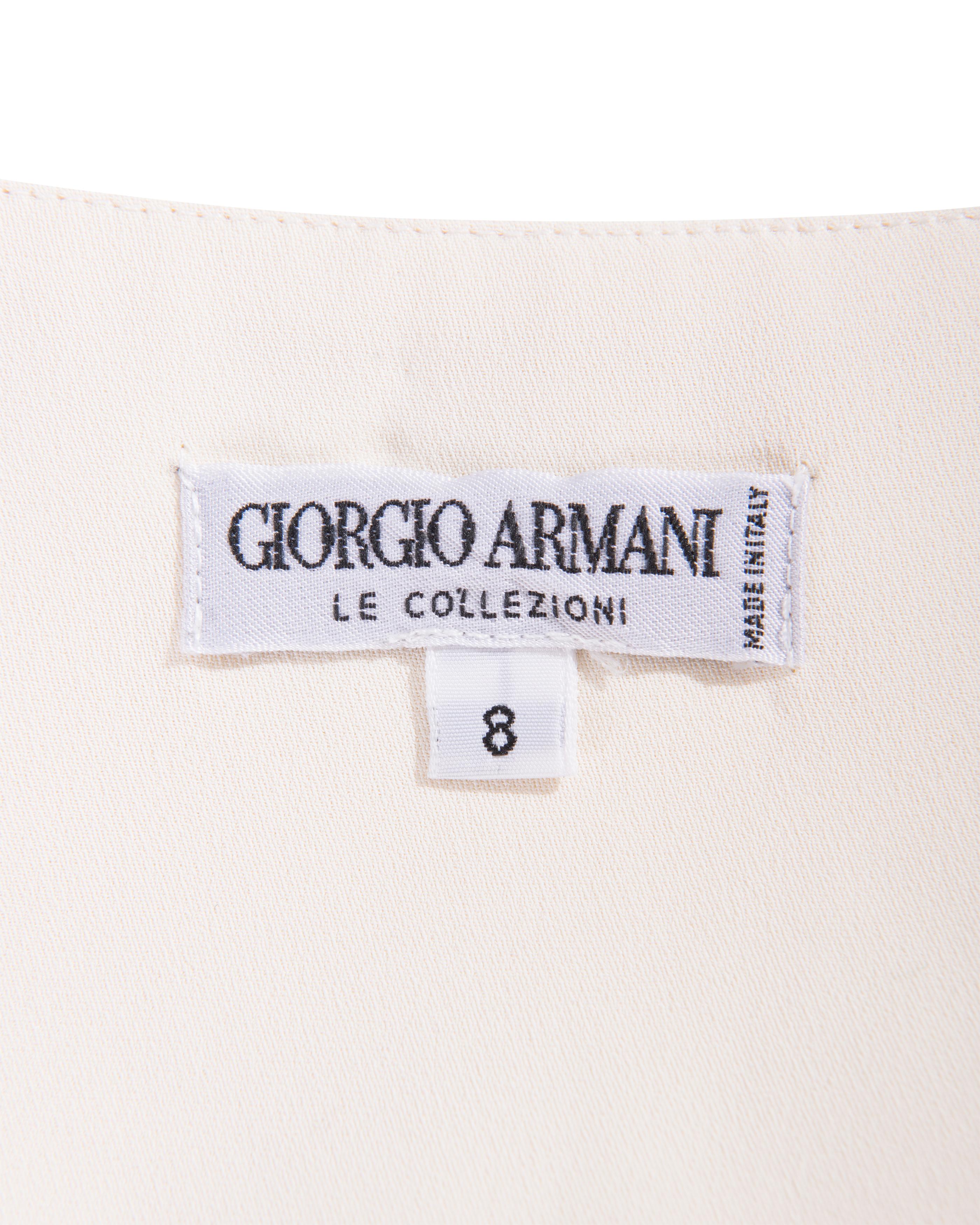 1990's Giorgio Armani ecru gown with sequin embellished bust and straps. Sleeveless square neckline slip gown with intricate center-front sequin detailing, with alternating ecru and white sequin and beaded sectioning. Concealed side zip closure.