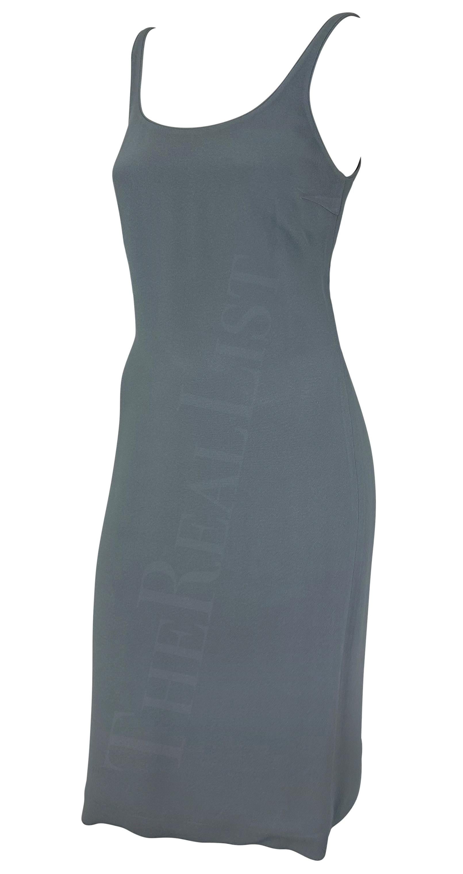 TheRealList presents: a grey Giorgio Armani dress. From the 1990s, this midi-length dress features a wide scoop neckline and thin straps. Masterfully constructed and effortlessly chic, this vintage Giorgio Armani dress is the perfect closet staple.