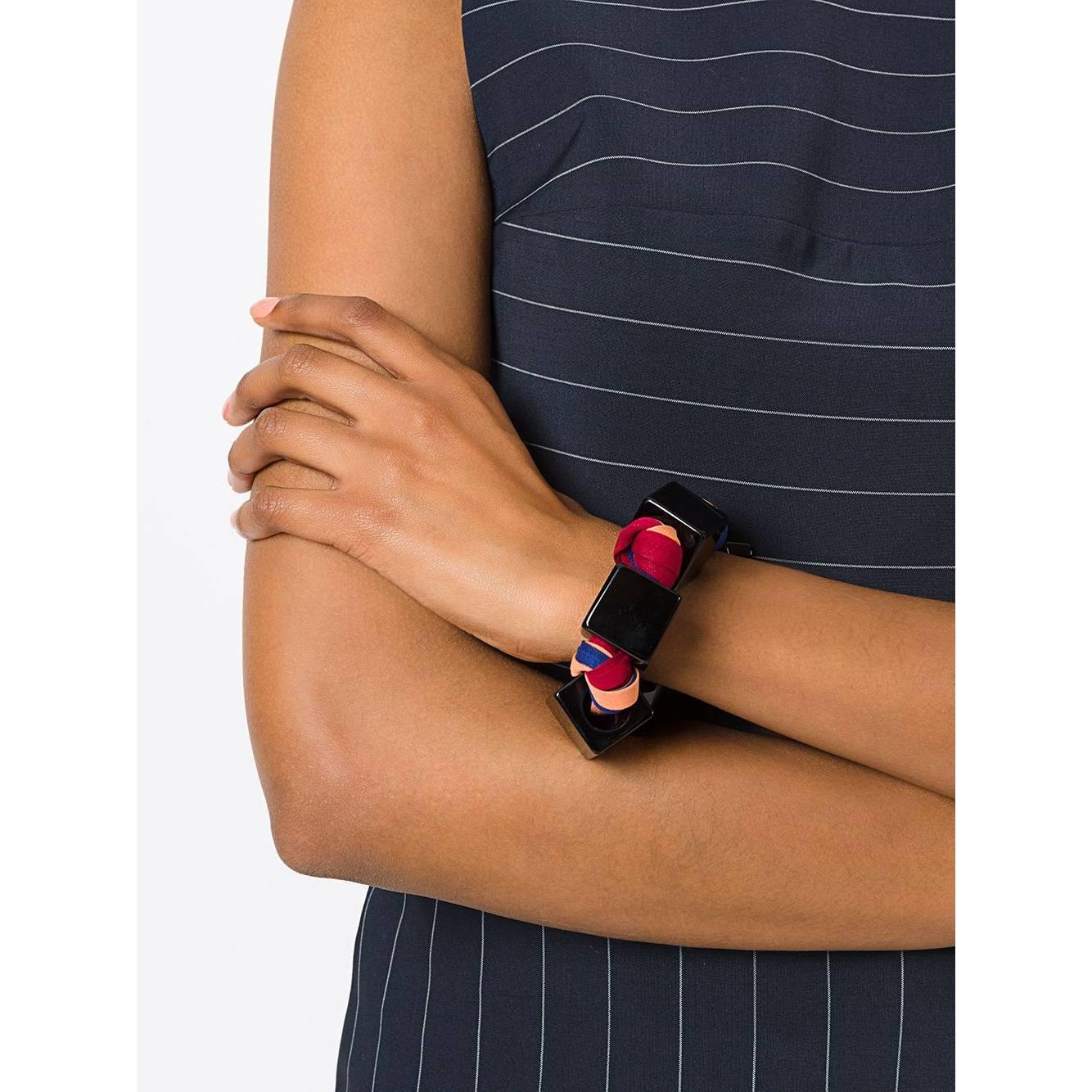Giorgio Armani multicolor viscose interwoven threads bracelet with black cubic synthetic pearls. T-bar lock.

Measurements
Length: 24 cm
Height: 2 cm

Product code: A5669

Notes: The product shows a nicked pearl and light signs of wear, as shown in
