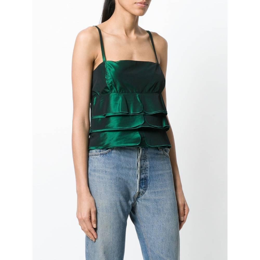 Giorgio Armani layered top in metallic green in mixed acetate fabric with thin straps and hidden back zip closure.
Years: 90s

Made in Italy

Size: 44 IT

Linear measures

Height: 50 cm
Bust: 44 cm