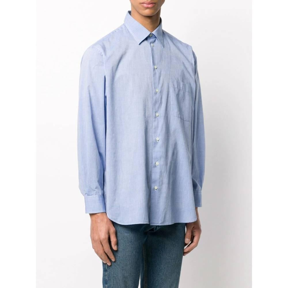 Giorgio Armani light blue shirt, with classic collar, front button closure, long sleeves, buttoned cuffs. 
Years: 90s

Made in Italy

Size: 42 IT

Linear measures

Height: 77 cm
Bust: 60 cm
Shoulders: 49 cm
Sleeves: 59 cm 