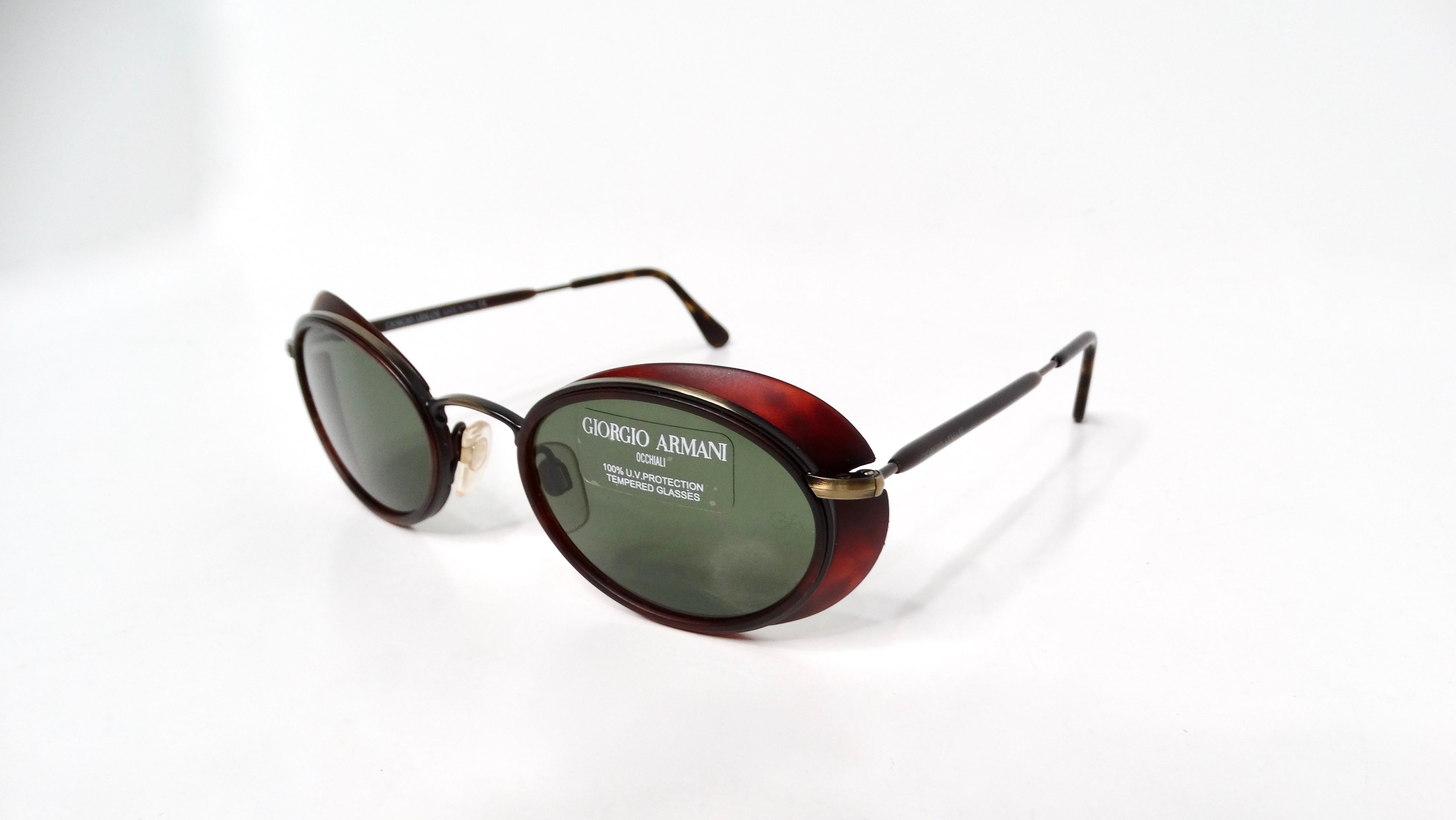 Step back into the chic style of the 1990s with these Giorgio Armani Red Tortoise Oval Retro Frame Green Tinted Sunglasses. These sunglasses blend retro elegance with a modern edge, featuring a distinctive oval shape that flatters various face