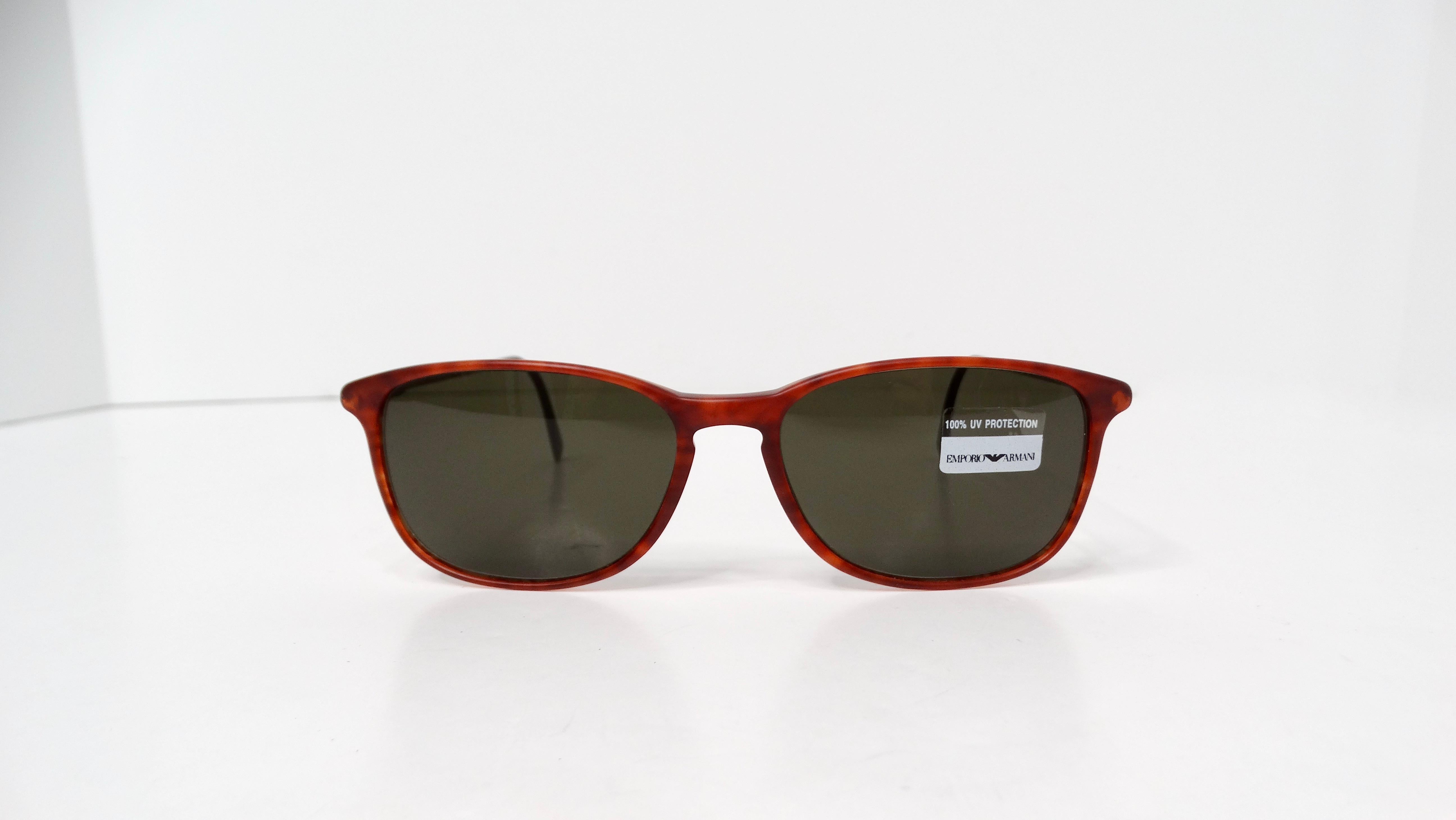Introducing the iconic 1990s Giorgio Armani Red Tortoise Wayfarer Gold-Tone Metal Sunglasses, a perfect fusion of vintage charm and contemporary elegance. Featuring reddish-brown tortoise frames, these sunglasses exude a luxurious vibe, while the