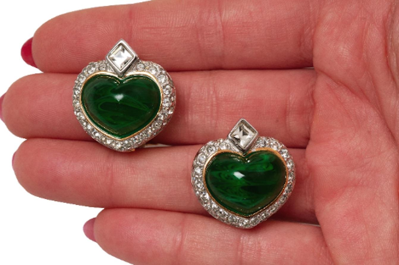 Superb 1990s gold and rhodium plate clip earrings featuring a large moulded glass heart centrepiece.  Surrounded by a double row of Swarovski crystals, a larger diamond sits above the green heart. These are top quality and I'm staggered that the