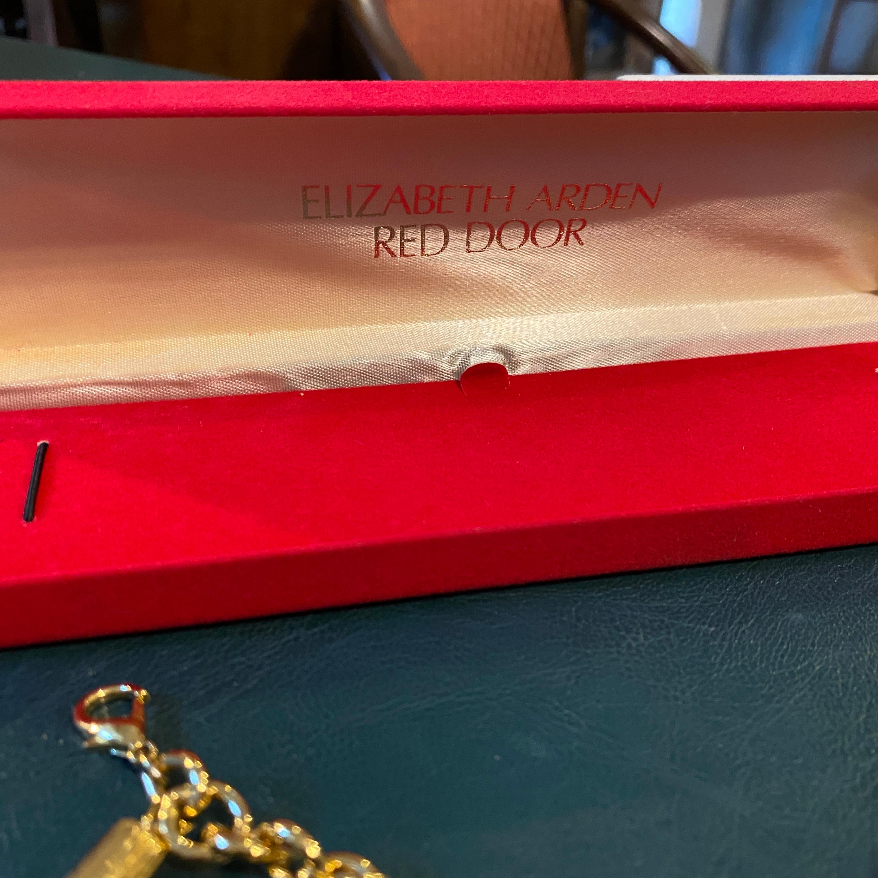 Women's 1990s Gold Electroplated Charm Bracelet by Elizabeth Arden For Sale