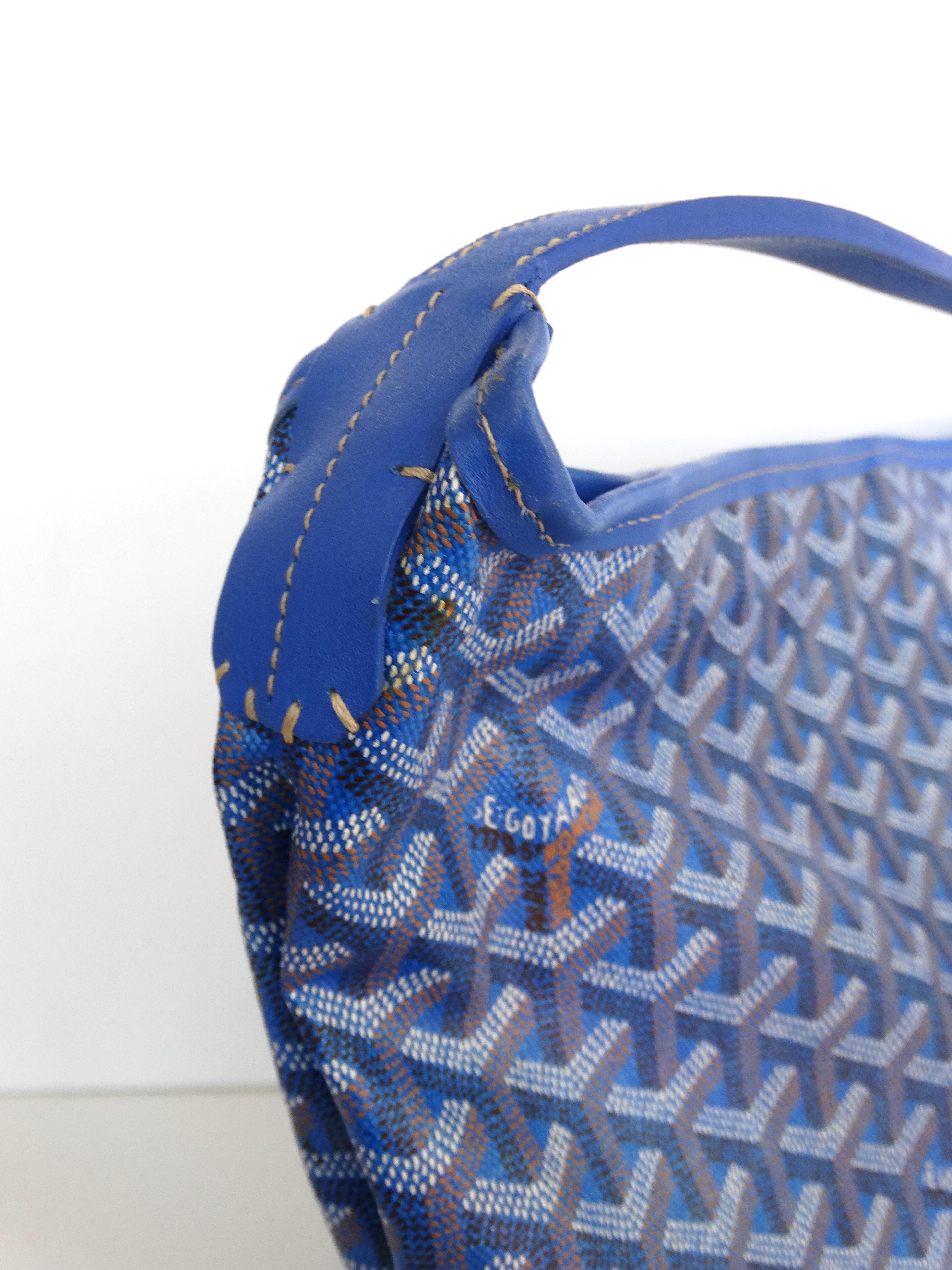 The Perfect Tote Bag For Every Day! Circa 1990s, this particular style is no longer in production, making it the perfect vintage item! This Goyard  Fidji hobo bag features the iconic Goyard monogram all over with hints of rust orange and is made of