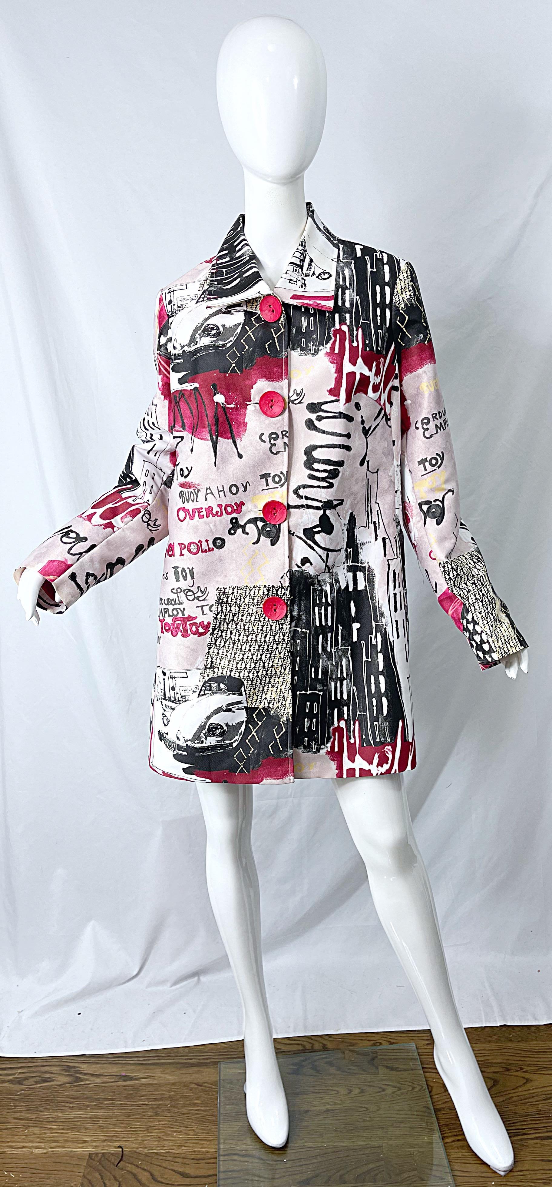 Amazing 1990s red, white and black graffiti novelty print rayon large size trench jacket ! Features vibrant prints with large red wooden buttons up the front. Pockets at each side of the hips. Fully lined. Can be worn open or closed. The perfect