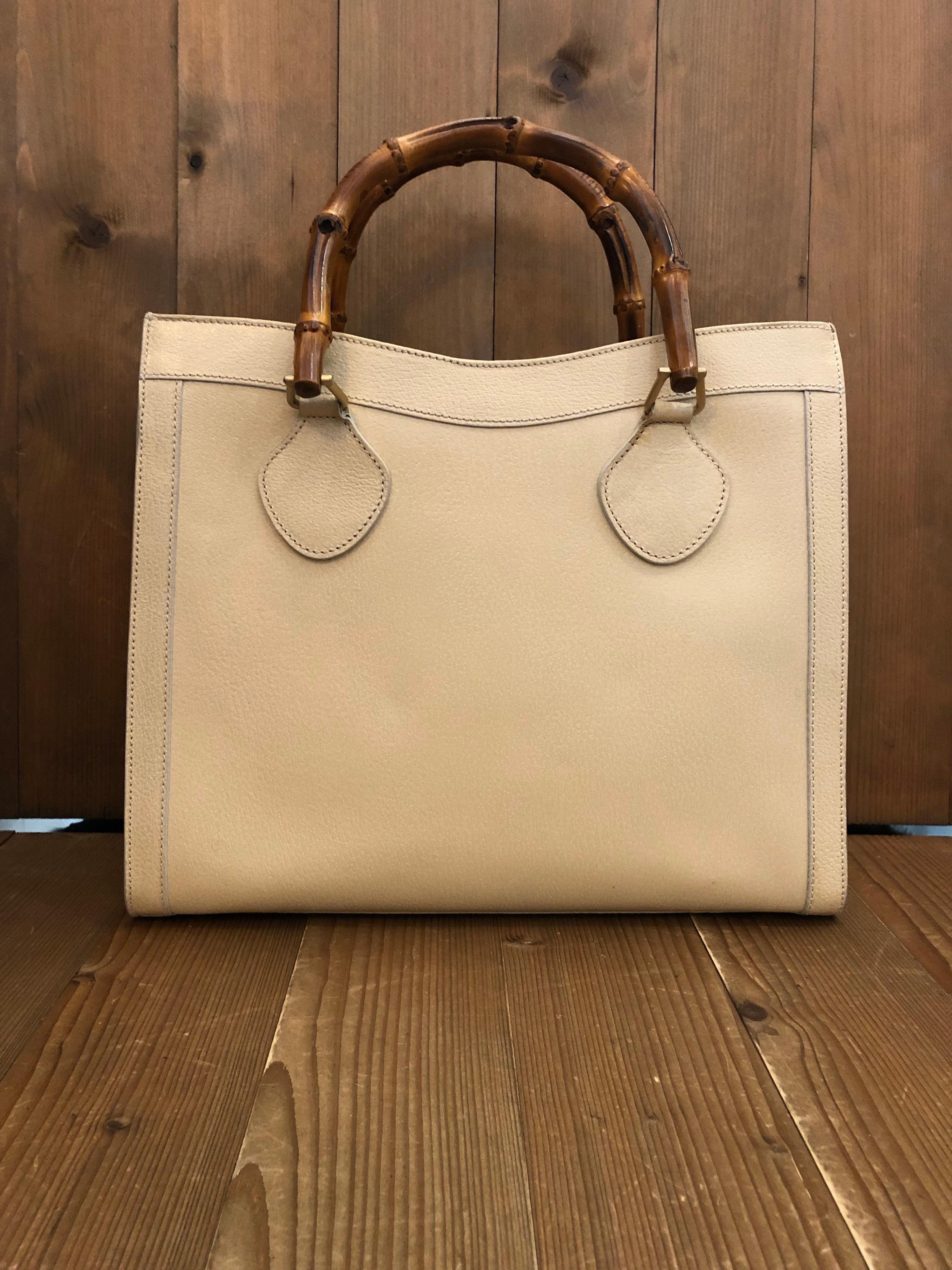 1990s Gucci bamboo tote in beige leather. The Bamboo tote is one of Princess Diana's favorite purses. Gucci revamped this Bamboo tote in 2021 winter collection. Made in Italy. Measures 13 x 11 x 5.5 inches handle drop 5 inches. It features two main