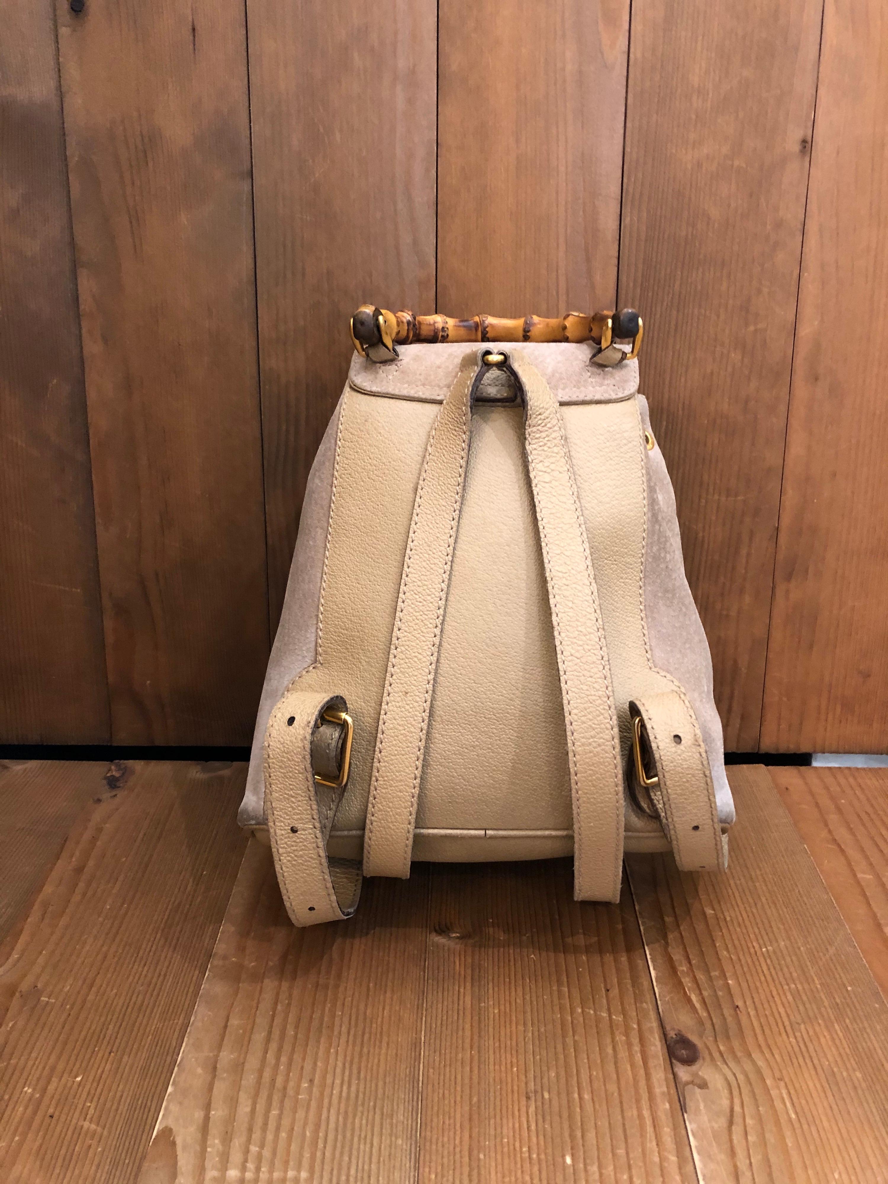 1990s Gucci mini backpack in beige colored suede/leather and Gucci iconic bamboo hardware featuring one interior zip pocket. The interior is lined with Gucci’s diamanté fabric. Made in Italy. Measures 9 x 8.25 x 4 inches. 

Condition - Some signs of