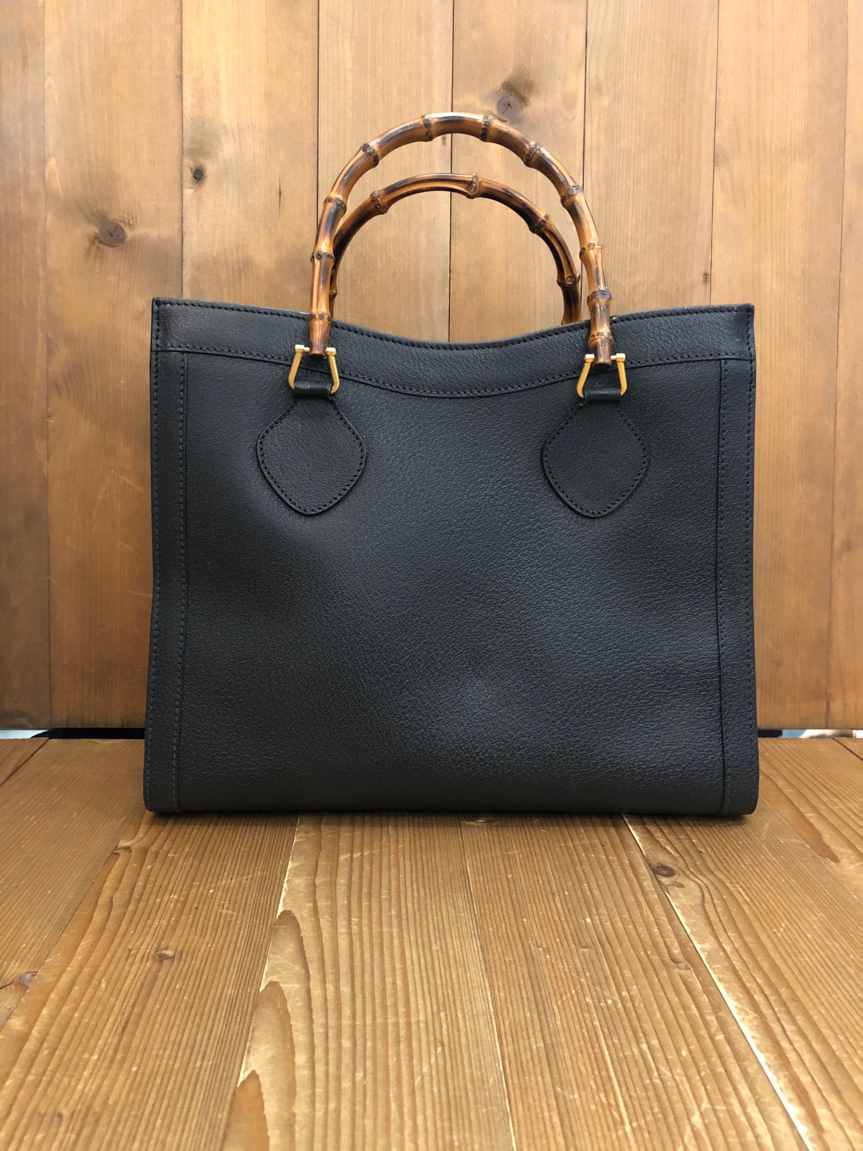 1990s Gucci bamboo tote in black leather. The Bamboo tote is one of Princess Diana's favorite purses. Gucci revamped this Bamboo tote in 2021 winter collection. Made in Italy. Measures 13 x 11 x 5.5 inches handle drop 5 inches. It features two main
