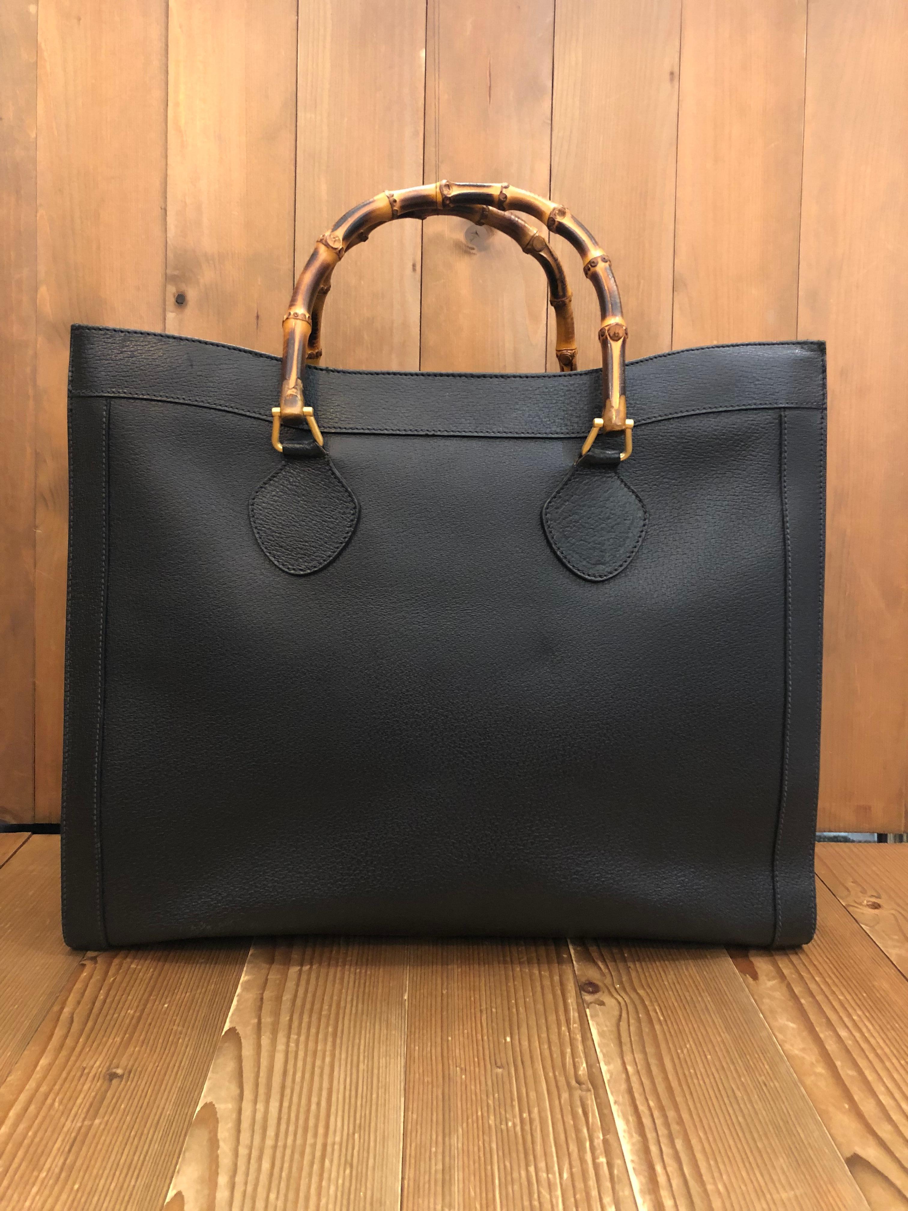 This vintage Gucci Diana Bamboo tote is crafted of pigskin leather in black featuring matte gold toned hardware. Top flap magnetic snap closure opens a new interior in black featuring two main open compartments and one middle zippered compartments