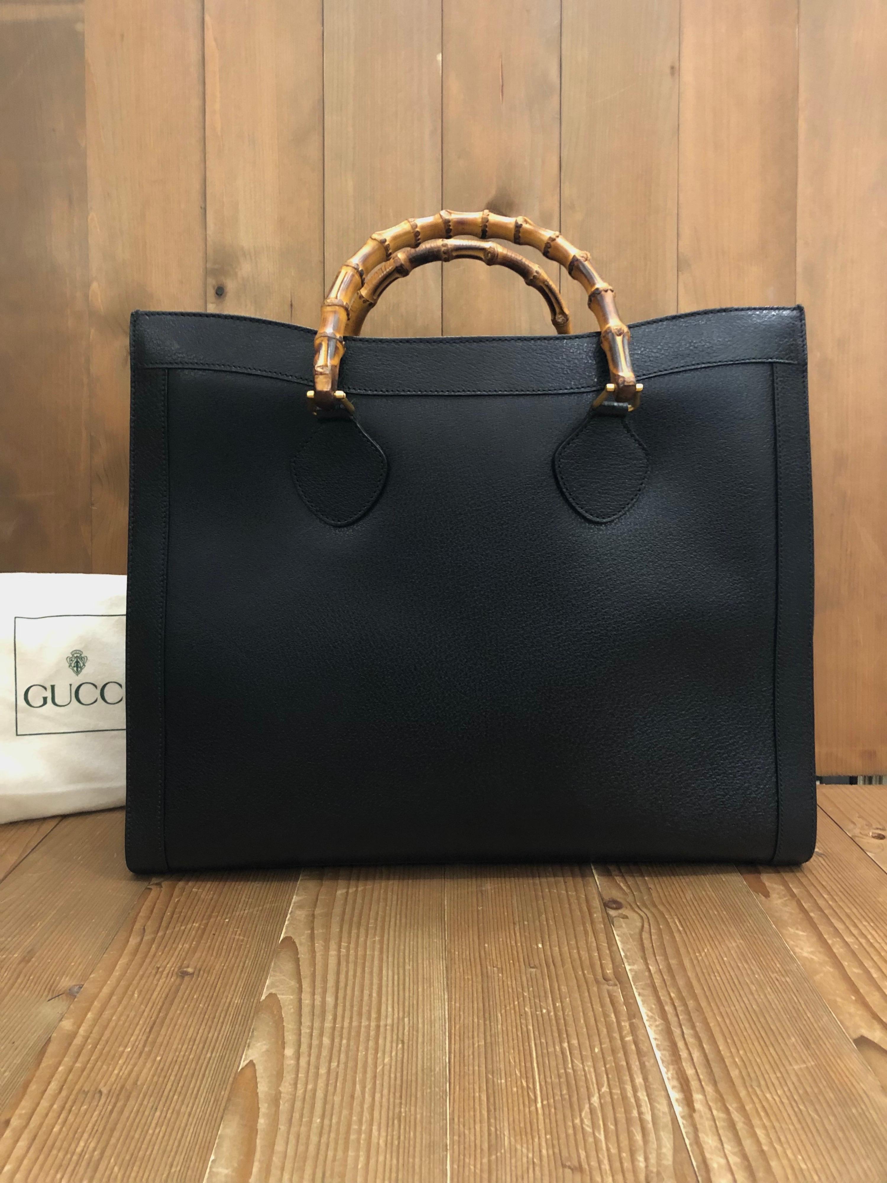 1990s Gucci bamboo tote in black leather. The Bamboo tote is one of Princess Diana's favorite purses. Gucci revamped this Bamboo tote in 2021 winter collection. Made in Italy. Measures 16.75 x 14 x 5.5 inches handle drop 4.5 inches featuring two