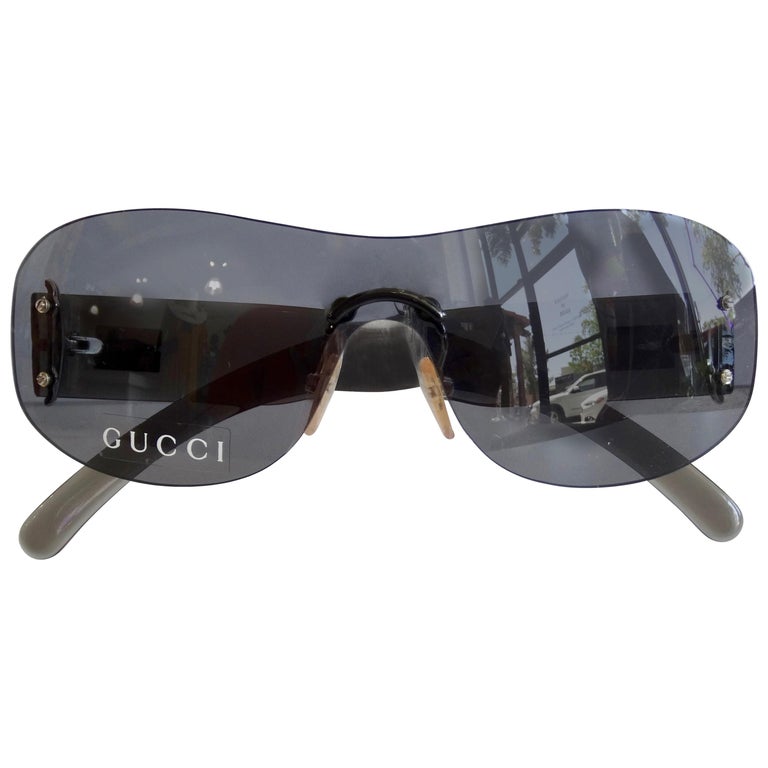 Gucci 1990s Black Rimless Shield Sunglasses Sale at 1stDibs | gucci rimless sunglasses, rimless gucci shield sunglasses